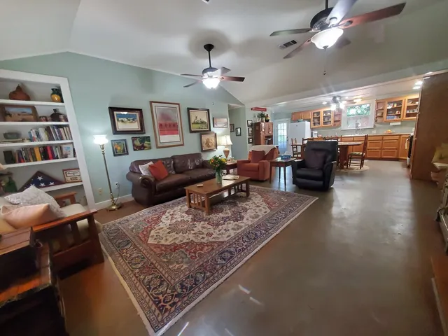 a living room with furniture and a rug