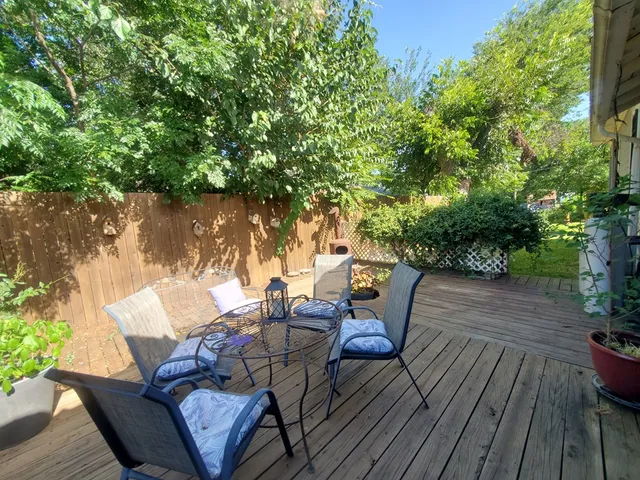 a view of a chairs and table on the wooden floor