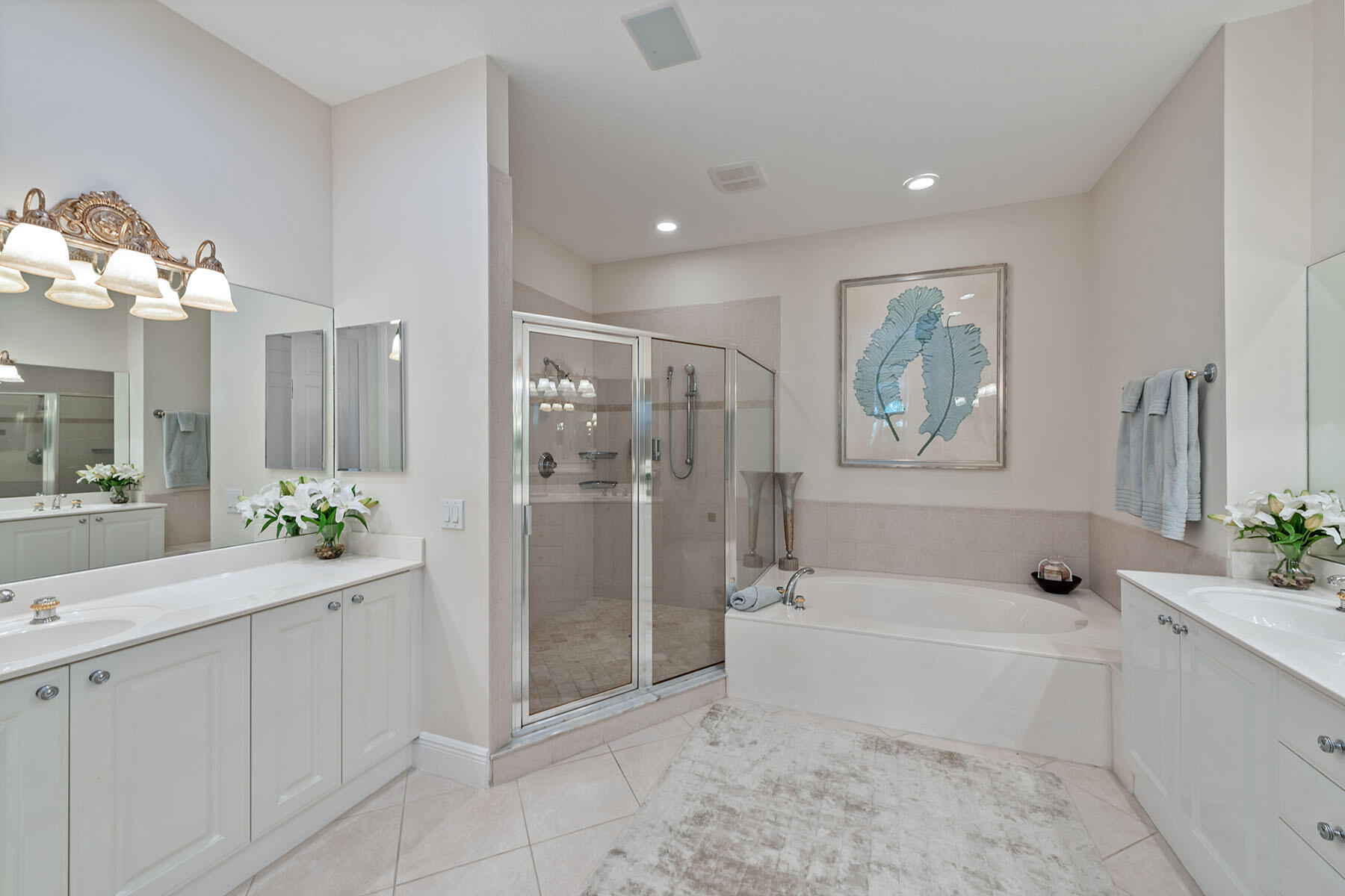 9110 Cascada Way, Unit 201 Naples, FL 34114 - Photo 14 of 50 a spacious bathroom with a granite countertop tub shower and mirror