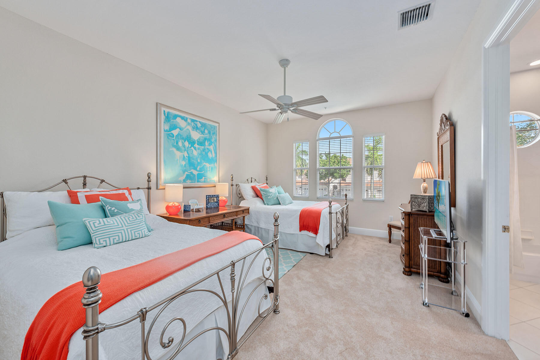9110 Cascada Way, Unit 201 Naples, FL 34114 - Photo 16 of 50 a bedroom with two beds and a large window