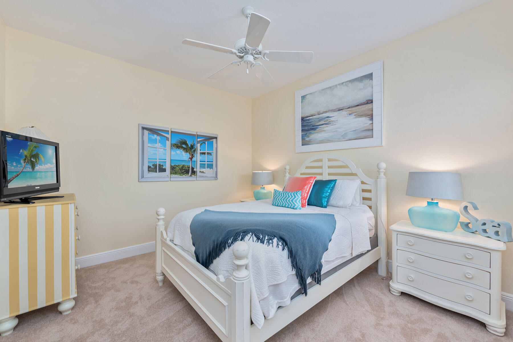9110 Cascada Way, Unit 201 Naples, FL 34114 - Photo 17 of 50 a bedroom with a bed and a flat screen tv