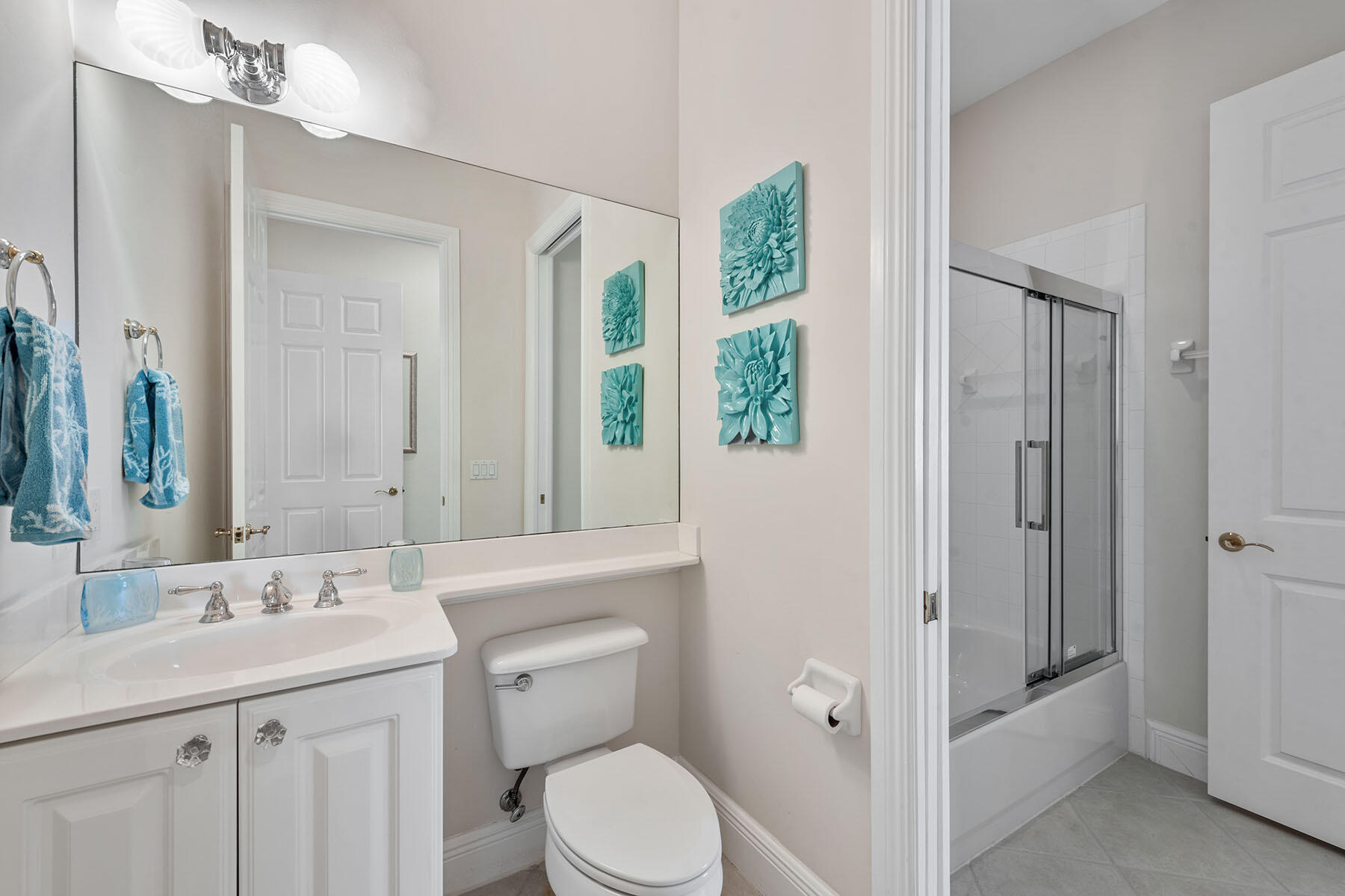 9110 Cascada Way, Unit 201 Naples, FL 34114 - Photo 19 of 50 a bathroom with a granite countertop sink toilet and shower
