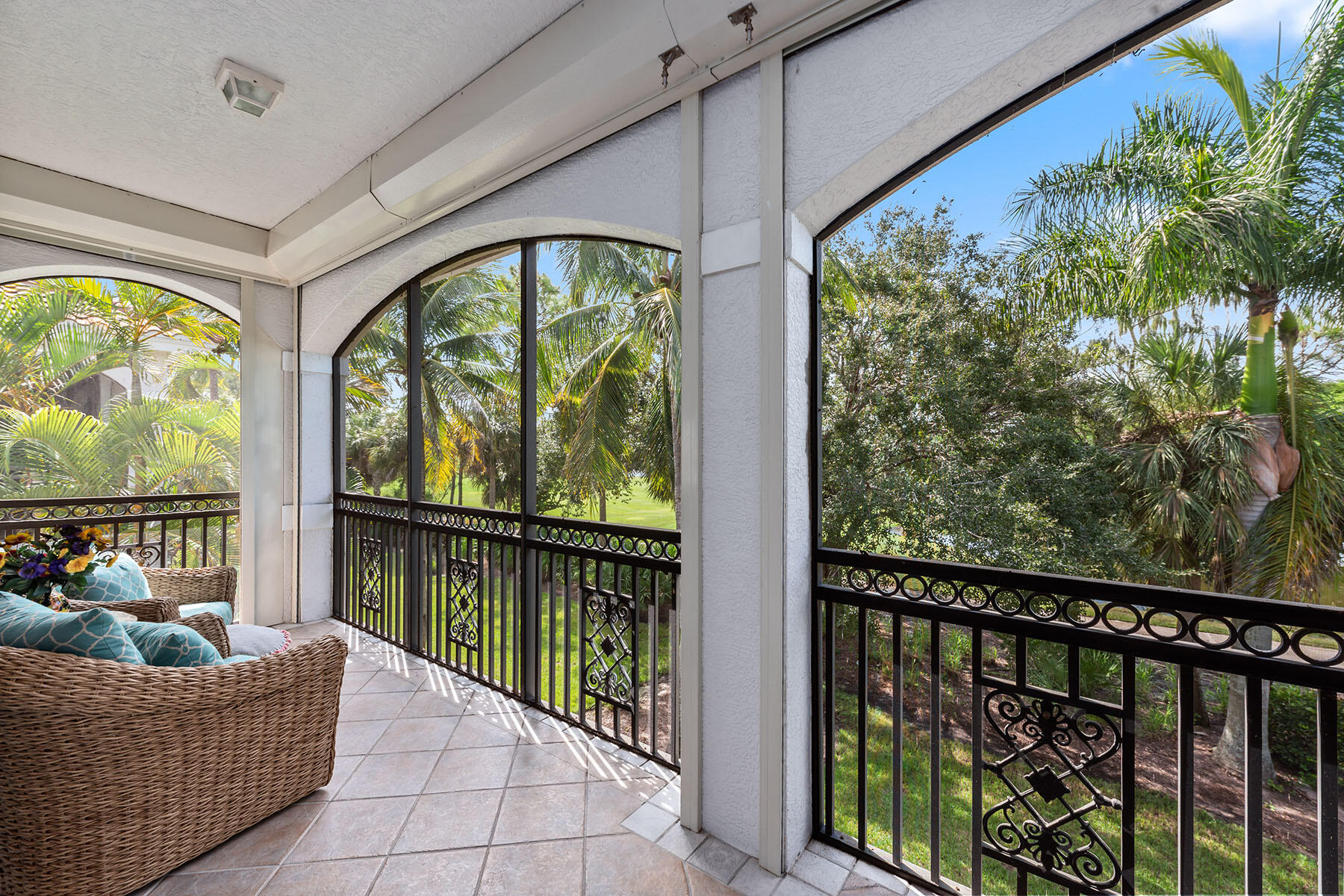 9110 Cascada Way, Unit 201 Naples, FL 34114 - Photo 22 of 50 a living room with furniture and a potted plant