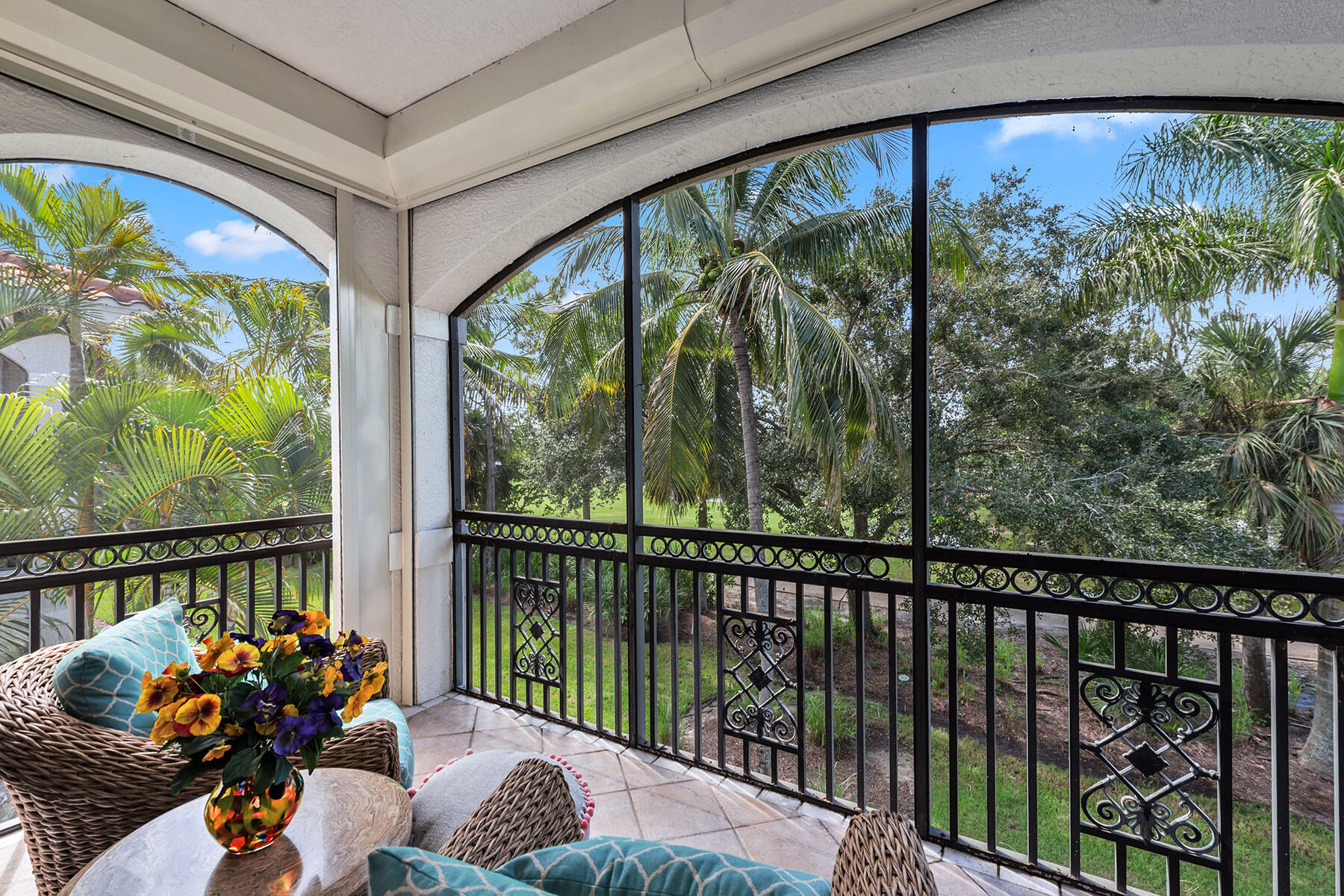 9110 Cascada Way, Unit 201 Naples, FL 34114 - Photo 25 of 50 a balcony with furniture and garden view