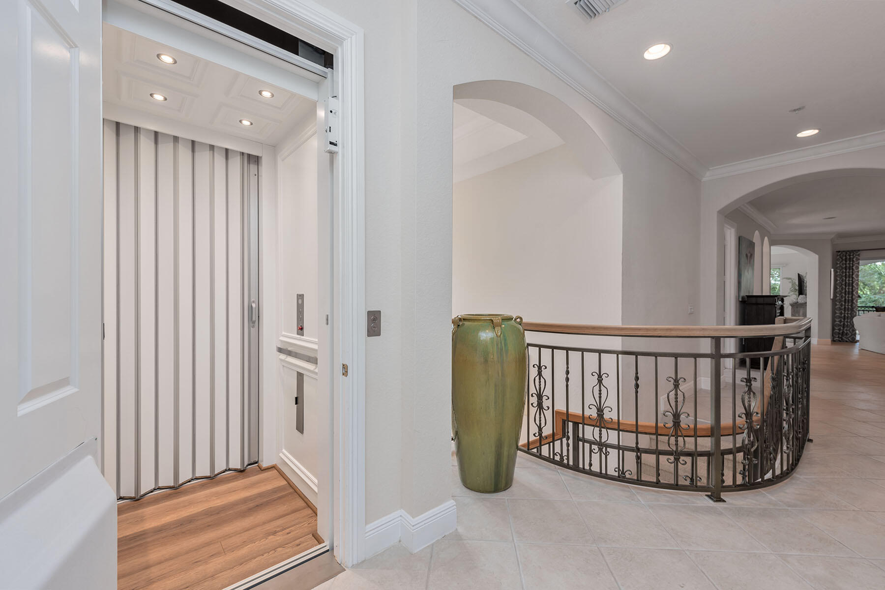 9110 Cascada Way, Unit 201 Naples, FL 34114 - Photo 27 of 50 a view of a hallway with windows