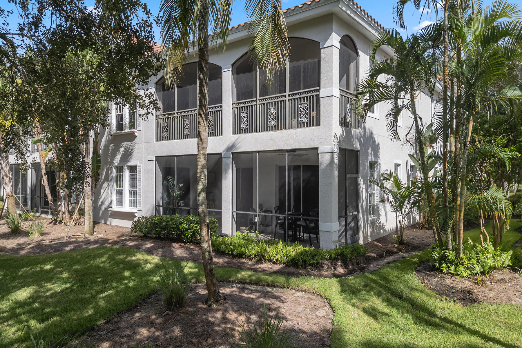 9110 Cascada Way, Unit 201 Naples, FL 34114 - Photo 29 of 50 a view of a house with a yard and potted plants