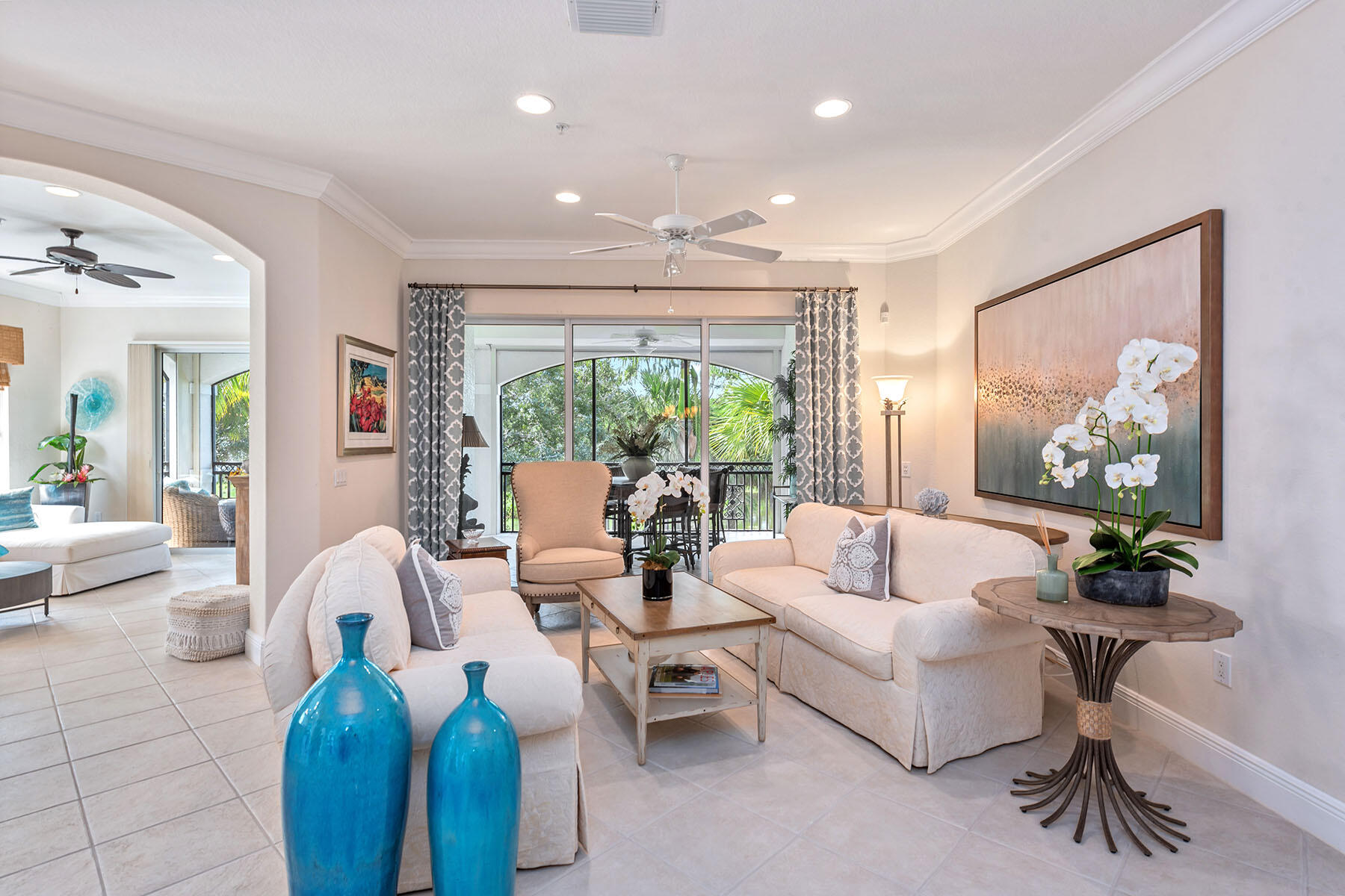 9110 Cascada Way, Unit 201 Naples, FL 34114 - Photo 3 of 50 a living room with furniture and a large window