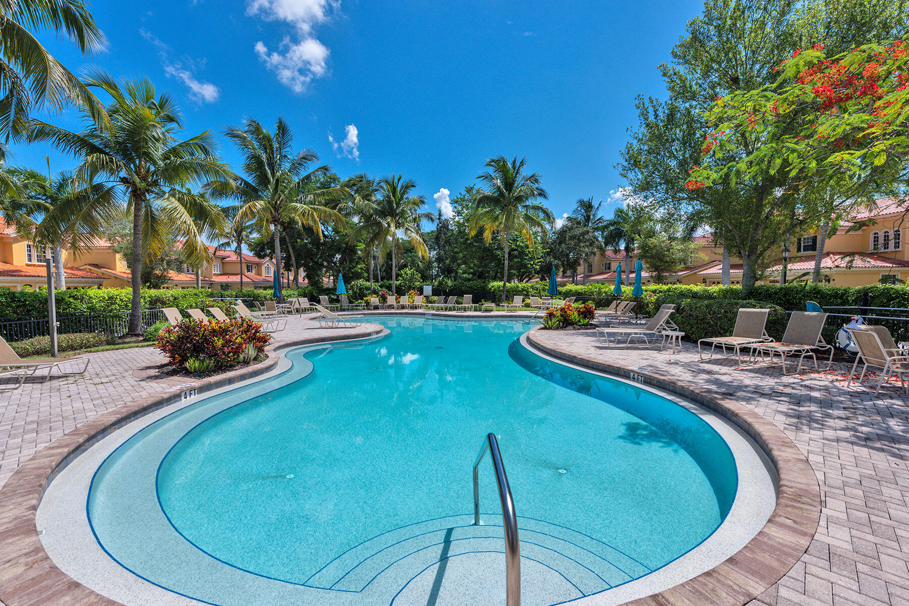 9110 Cascada Way, Unit 201 Naples, FL 34114 - Photo 32 of 50 a view of a swimming pool with an outdoor space and seating area