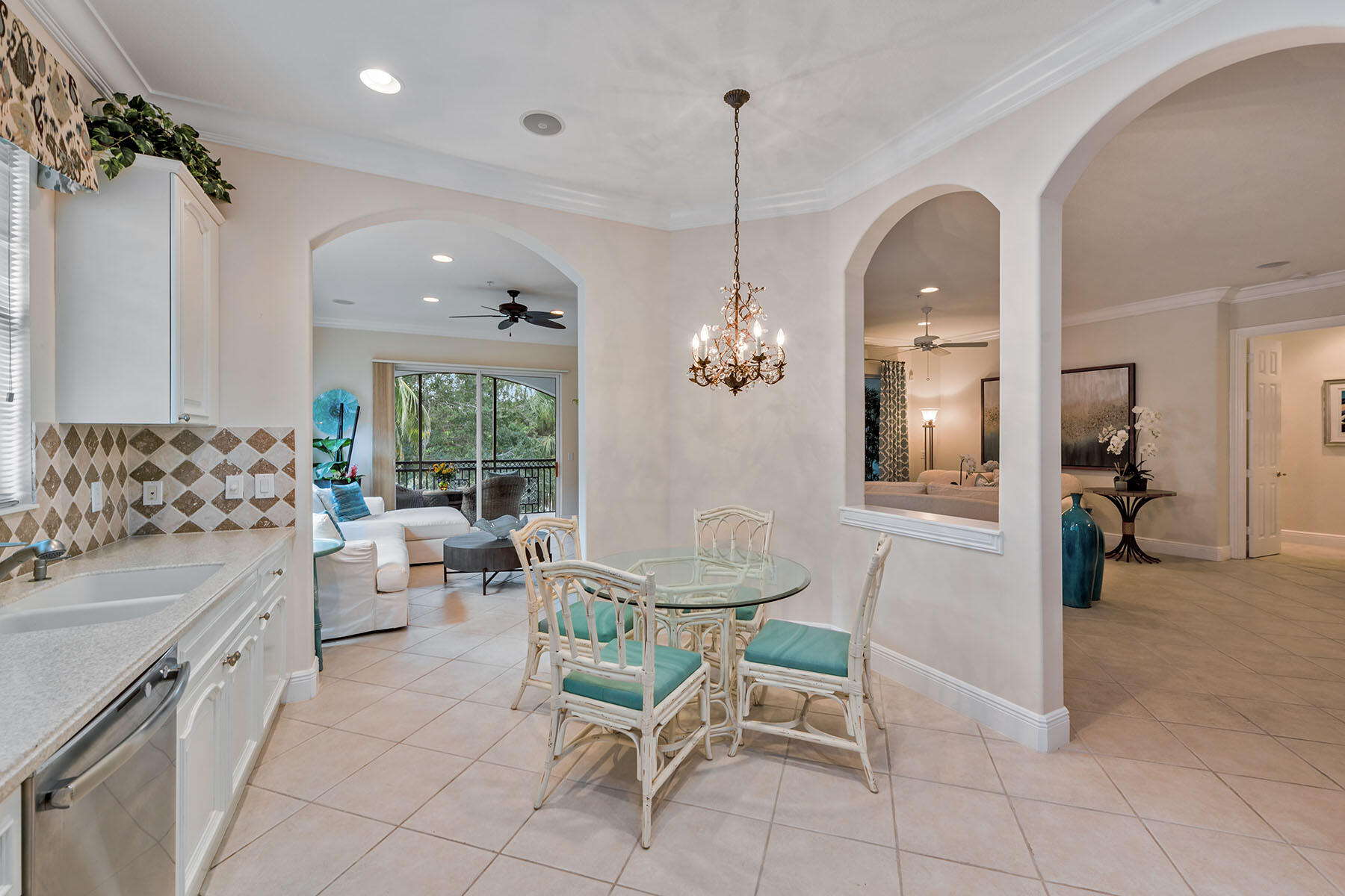 9110 Cascada Way, Unit 201 Naples, FL 34114 - Photo 9 of 50 a view of a kitchen and dining room