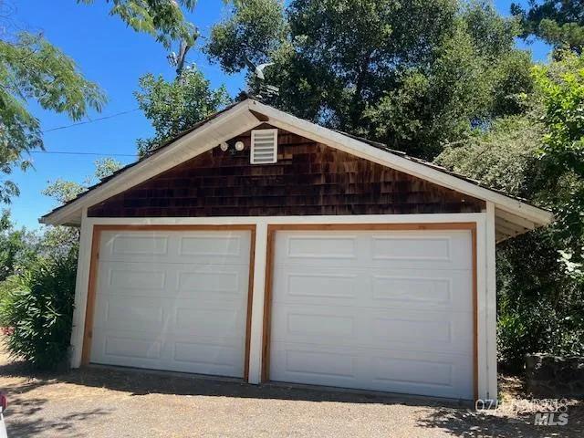 a back view of house along with trees