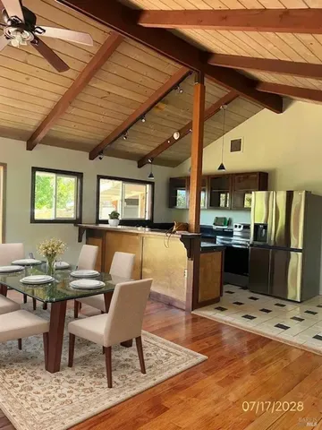 a living room with lots of furniture and a rug