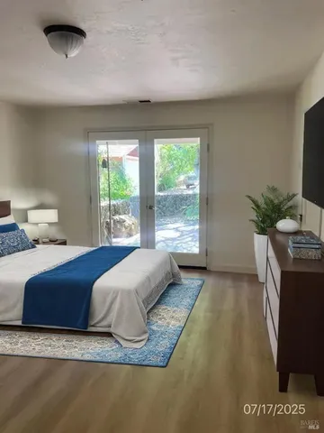 a spacious bedroom with a bed and a couch