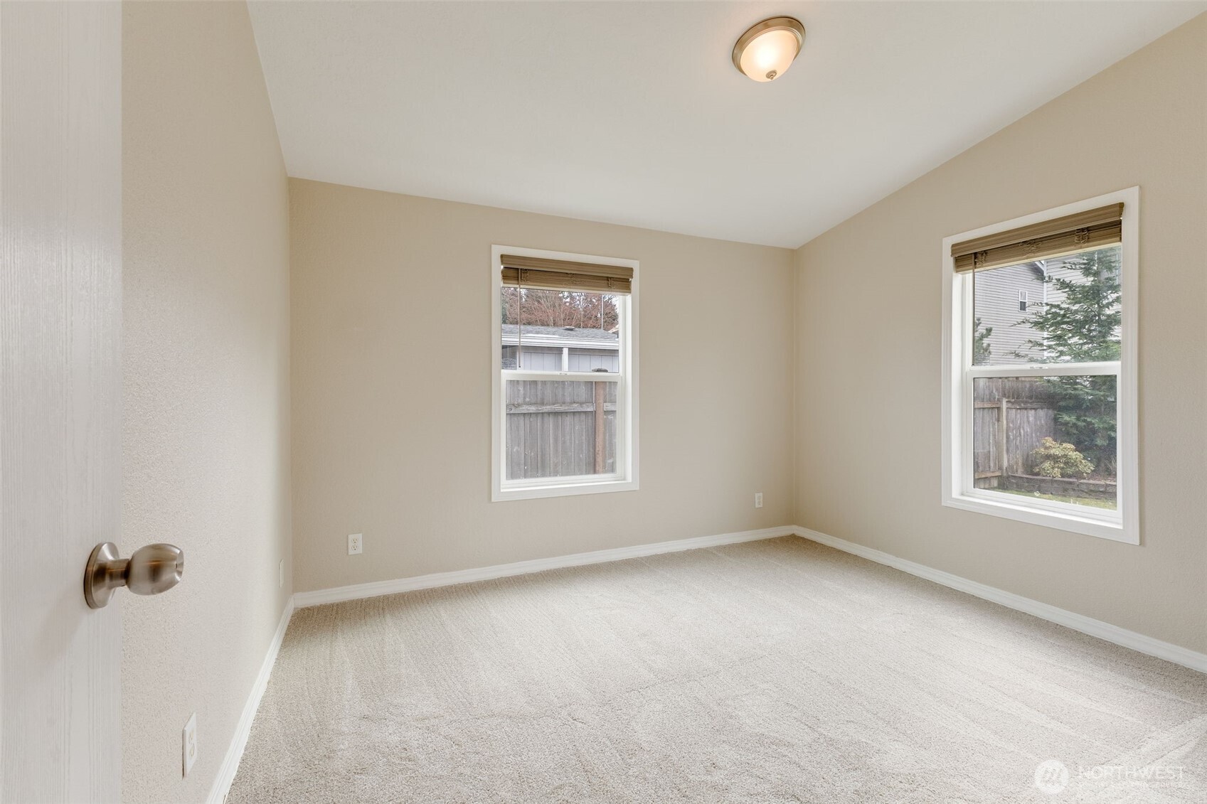10420 197th Street East Graham, WA 98338 - Photo 14 of 21 an empty room with windows and closet