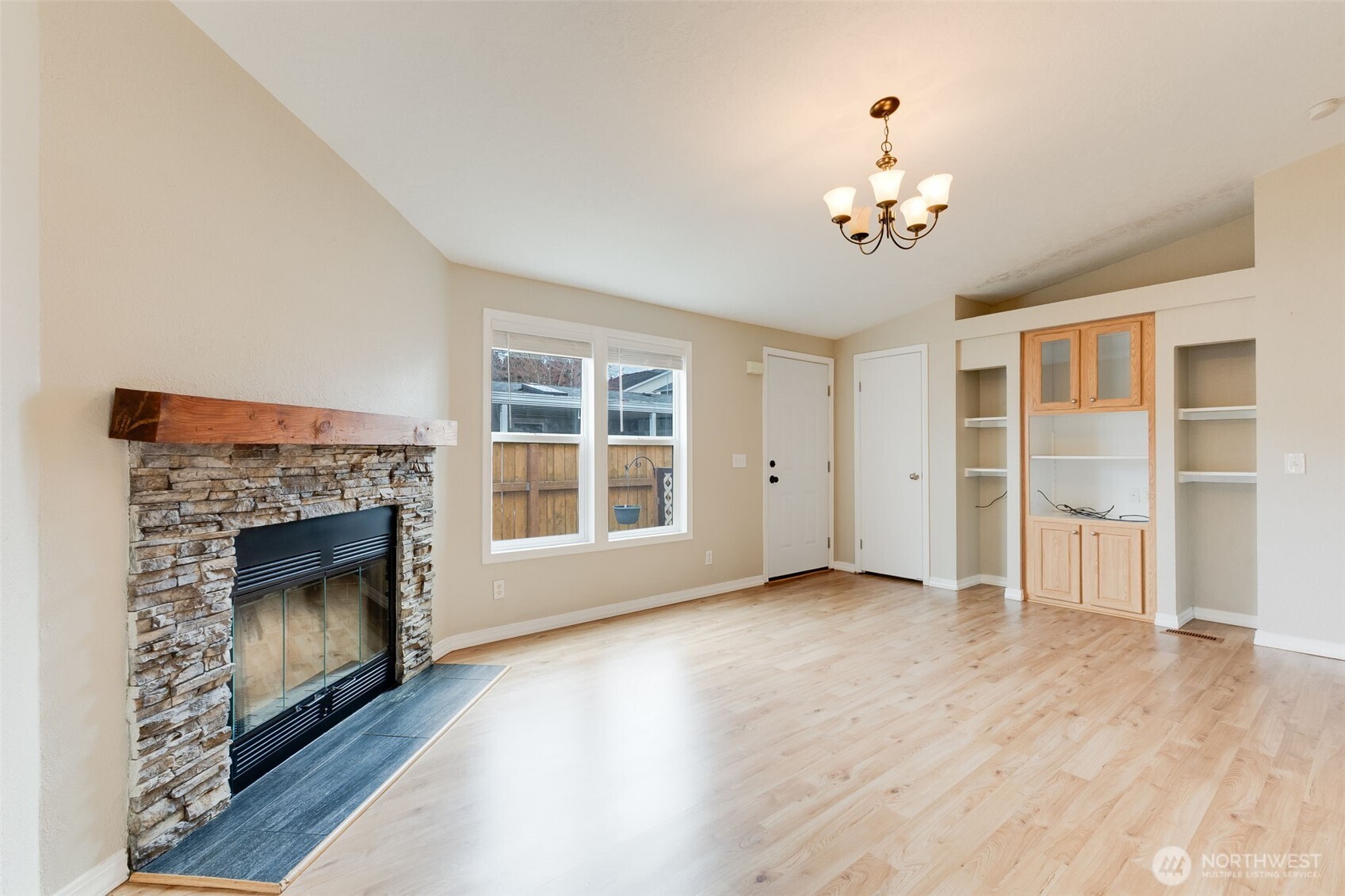 10420 197th Street East Graham, WA 98338 - Photo 7 of 21 a view of an empty room with a fireplace and a window