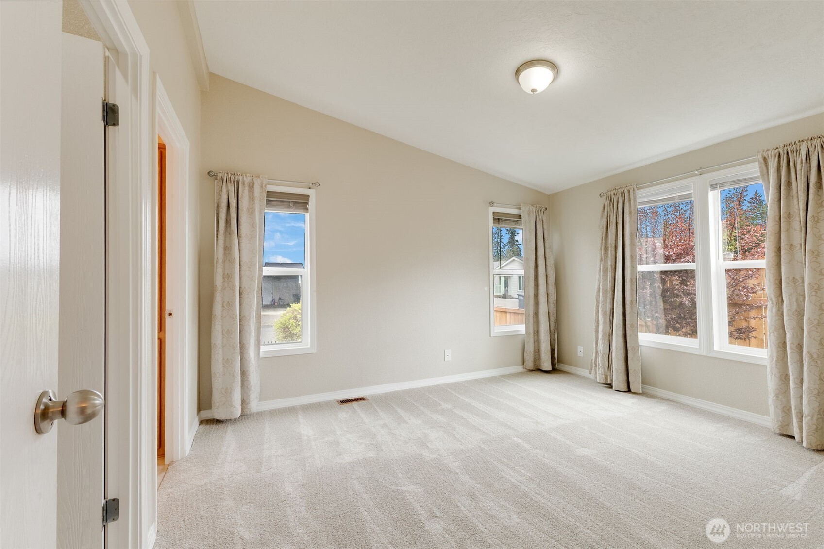 10420 197th Street East Graham, WA 98338 - Photo 9 of 21 a view of an empty room with a window