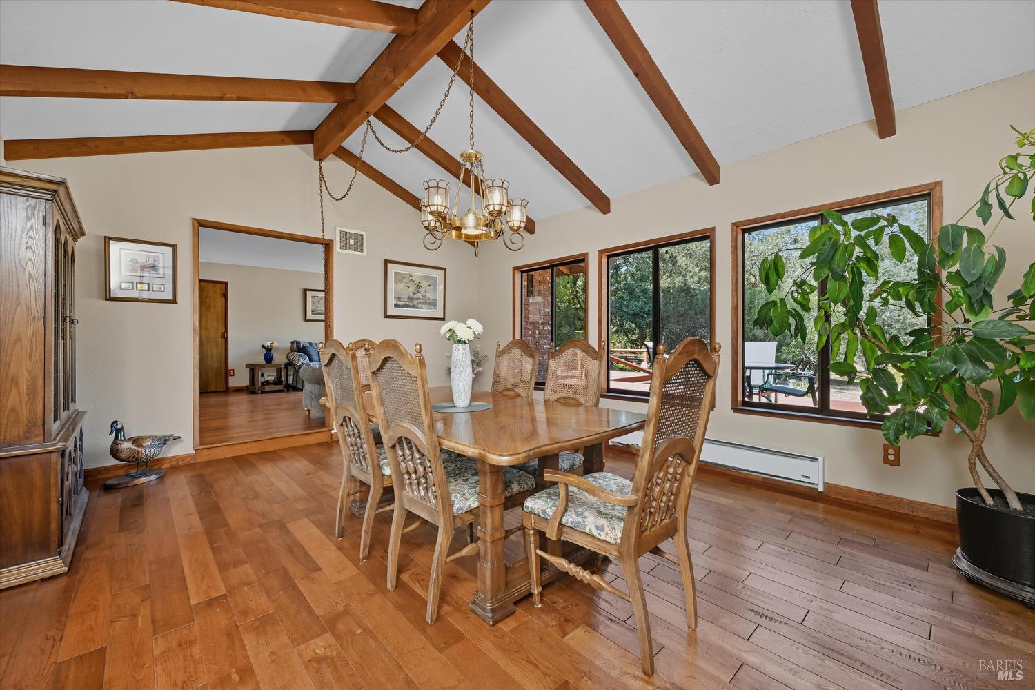 2487 Olivet Road Santa Rosa, CA 95401 - Photo 13 of 48 a view of a dining room with furniture window and wooden floor