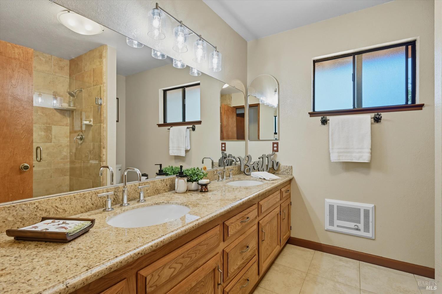 2487 Olivet Road Santa Rosa, CA 95401 - Photo 33 of 48 a bathroom with a granite countertop sink and a mirror