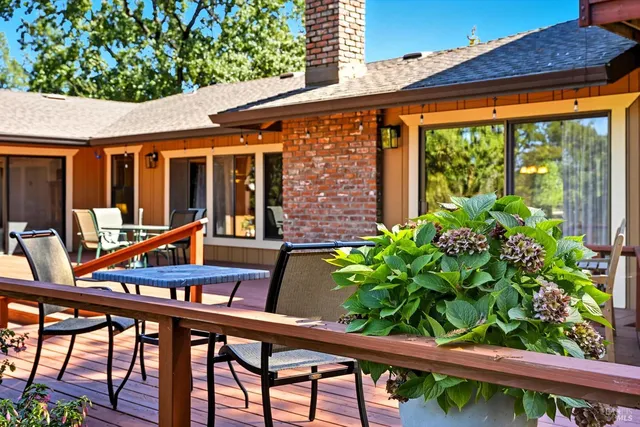 a view of a chairs and table in patio