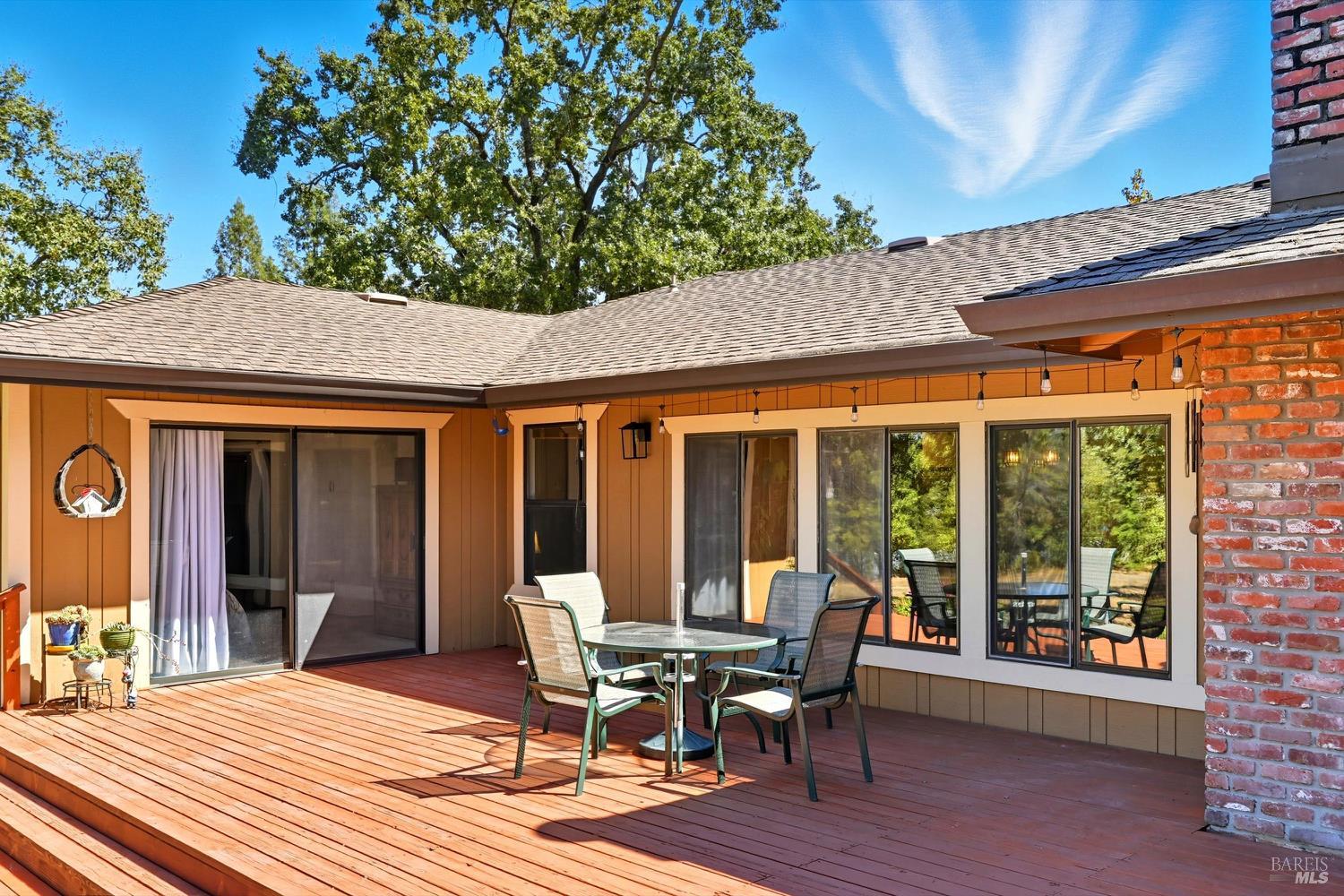 2487 Olivet Road Santa Rosa, CA 95401 - Photo 36 of 48 a patio with wooden floor table and chairs