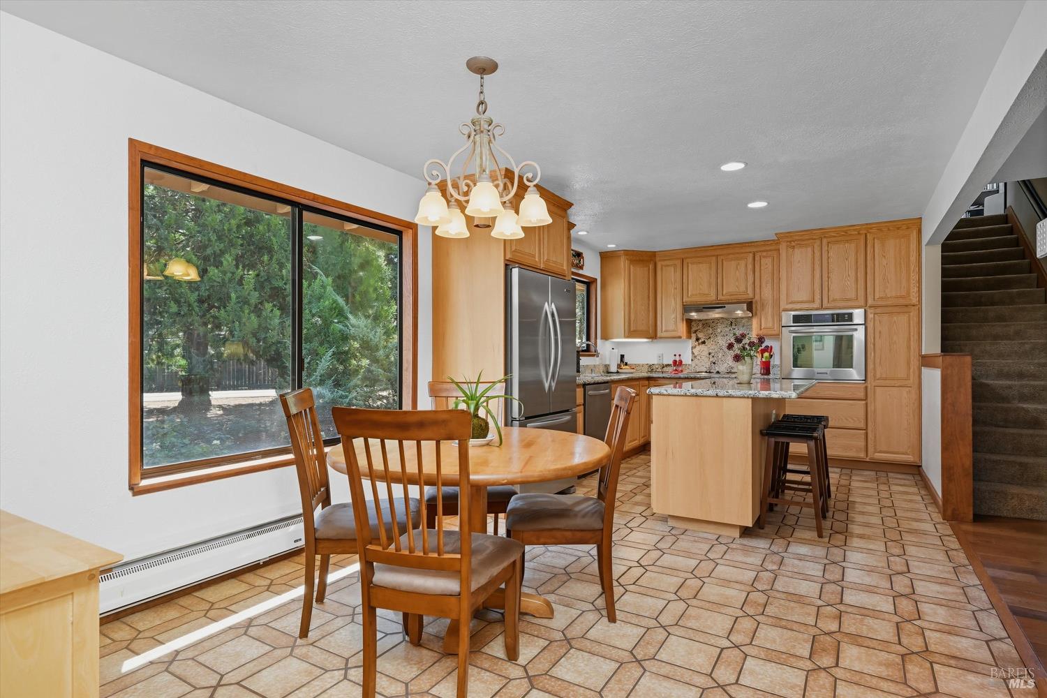 2487 Olivet Road Santa Rosa, CA 95401 - Photo 6 of 48 a dining room with furniture a chandelier and window