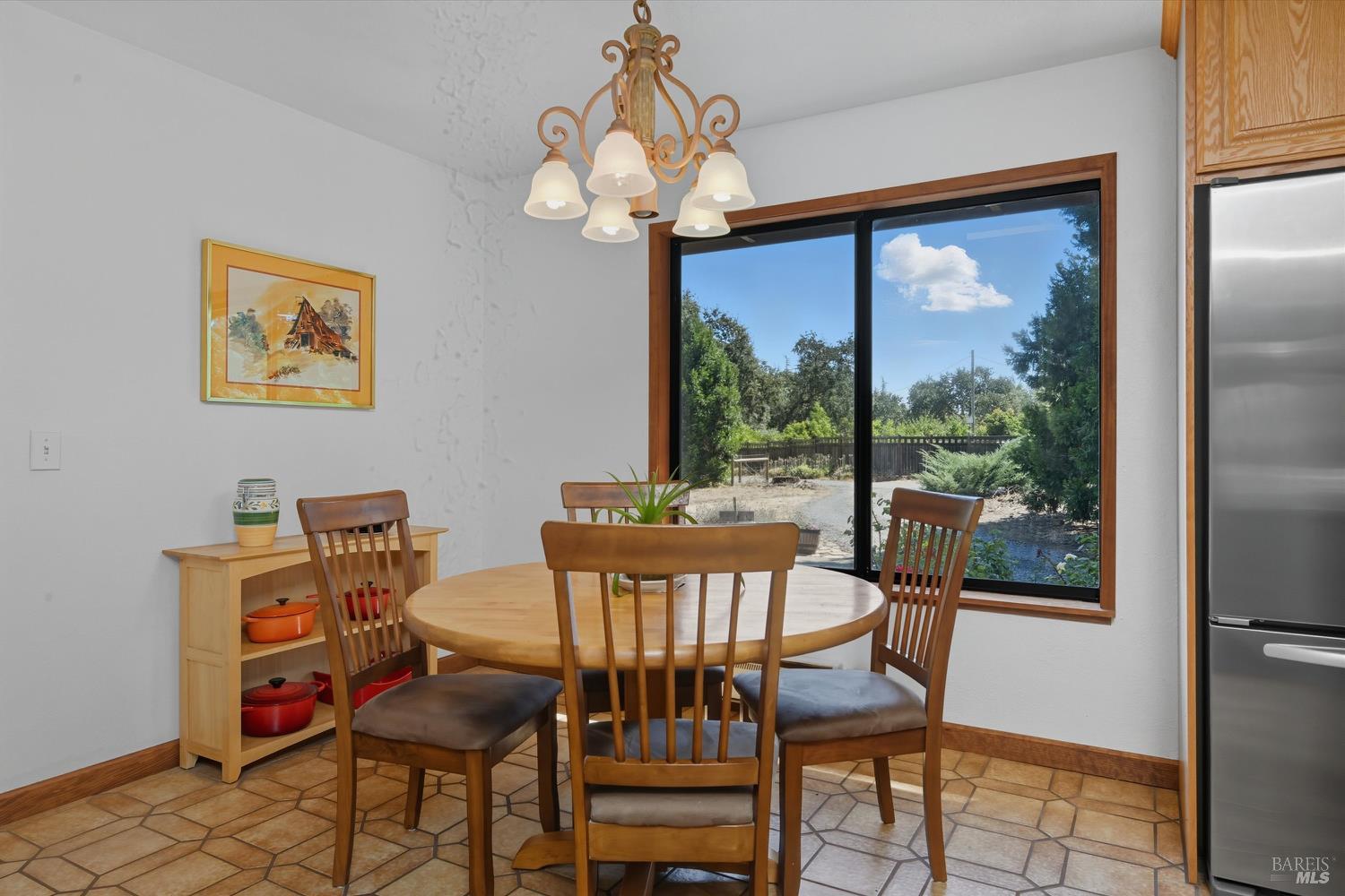 2487 Olivet Road Santa Rosa, CA 95401 - Photo 10 of 48 a view of a dining room with furniture wooden floor and a chandelier