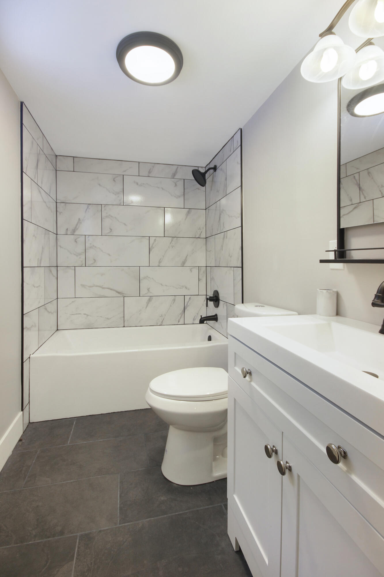 6327 Garfield Avenue Hammond, IN 46324 - Photo 13 of 20 a bathroom with a toilet a sink and bathtub