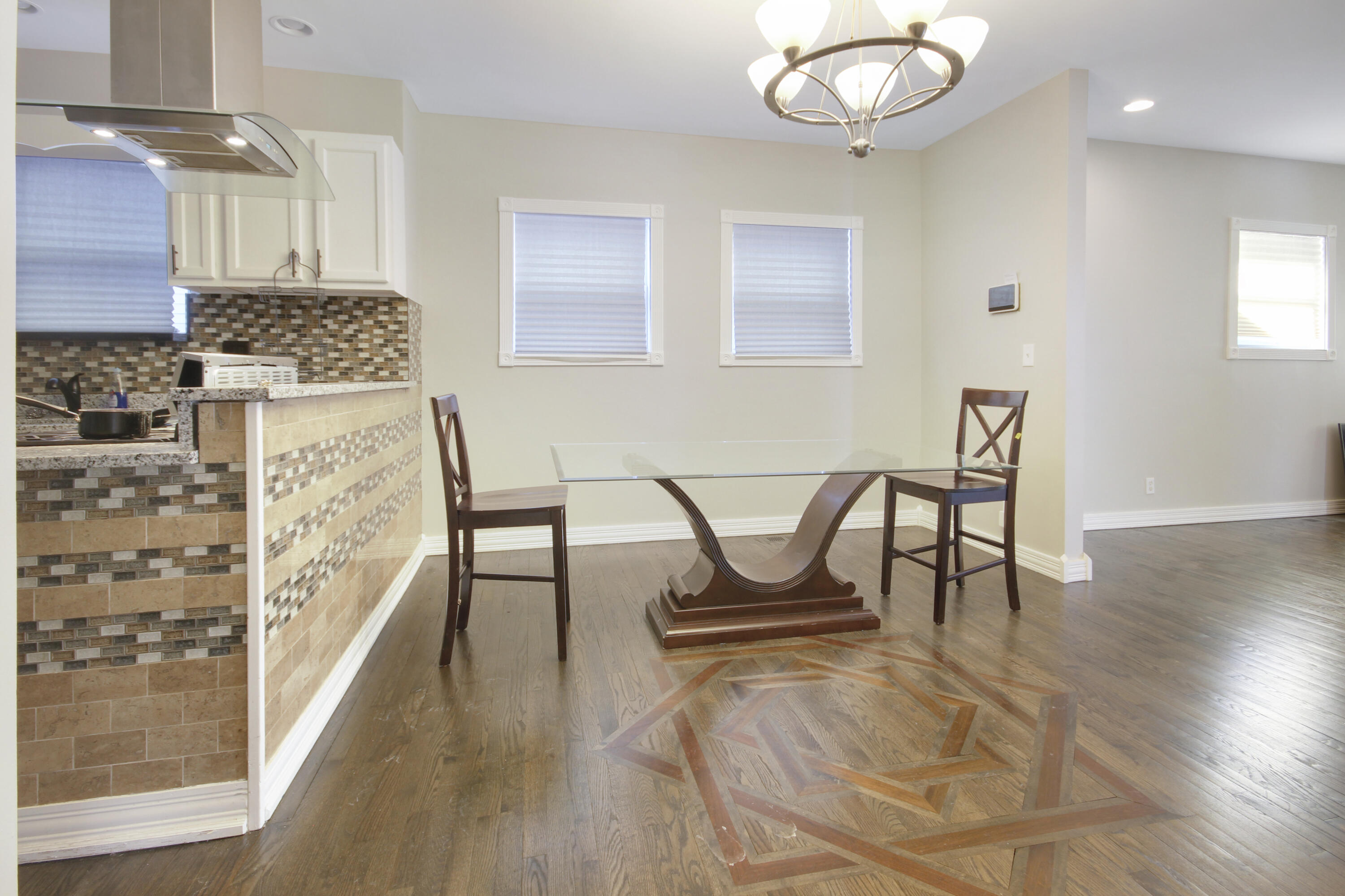6327 Garfield Avenue Hammond, IN 46324 - Photo 2 of 20 a view of dining room and hall with wooden floor