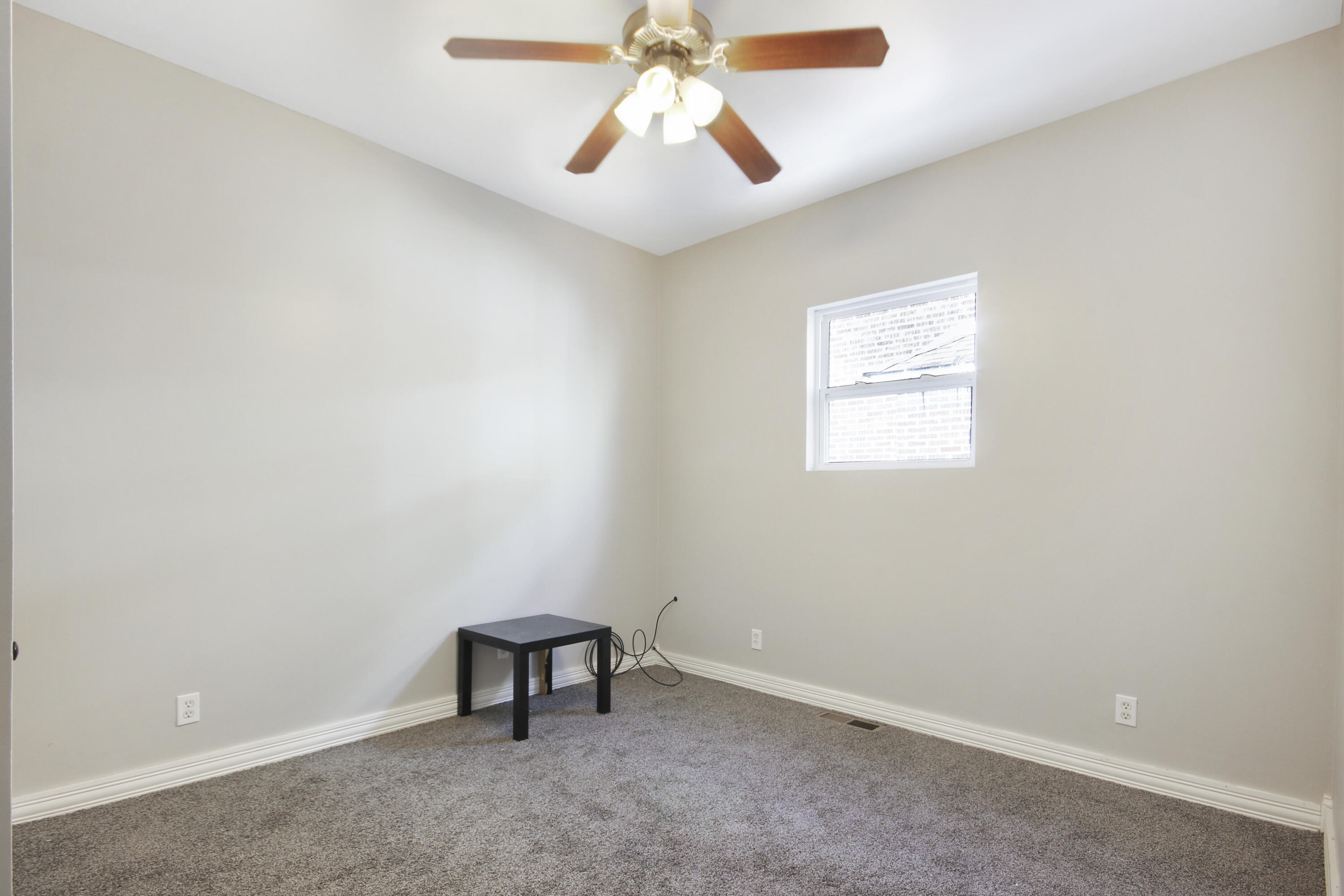 6327 Garfield Avenue Hammond, IN 46324 - Photo 9 of 20 an empty room with chandelier fan