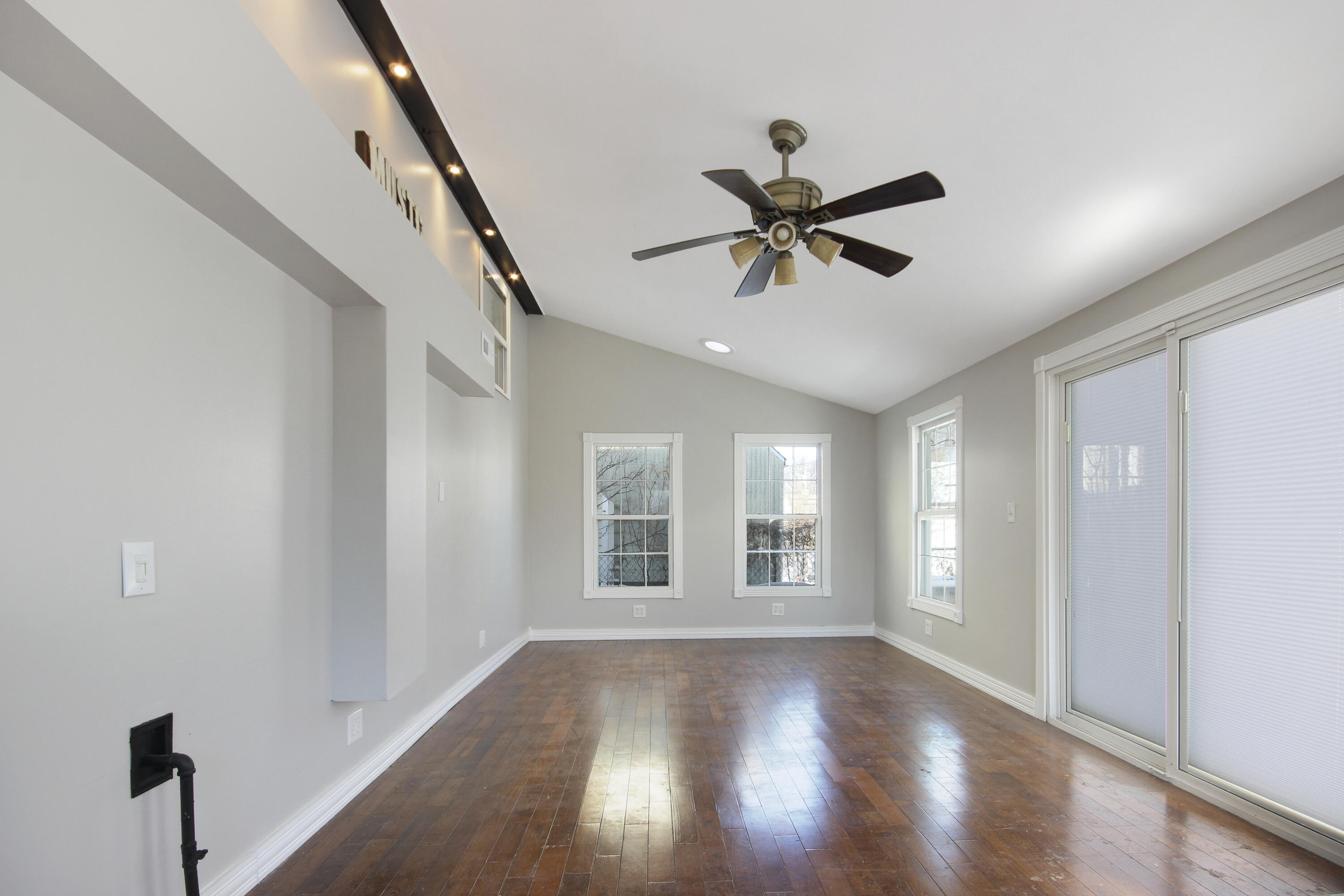6327 Garfield Avenue Hammond, IN 46324 - Photo 10 of 20 a view of empty room with wooden floor and fan