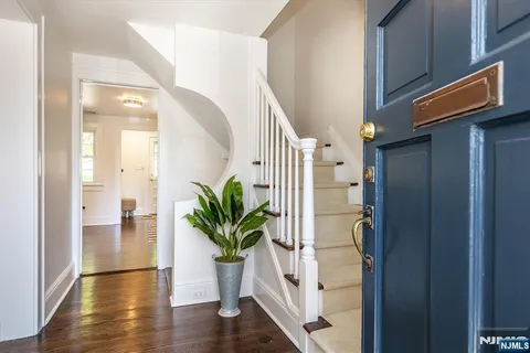 a view of entryway with wooden floor