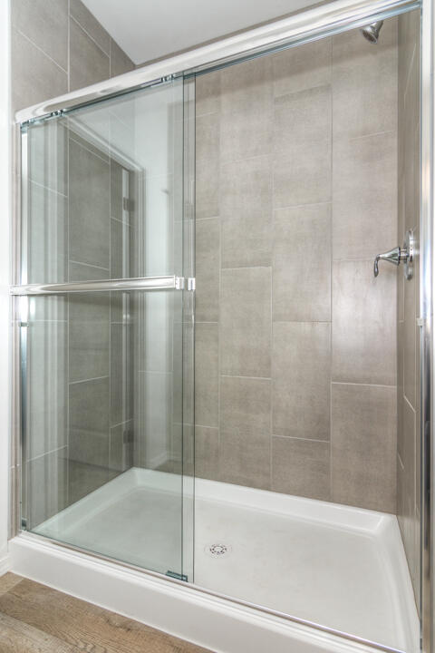 17084 Indio Road Bend, OR 97707 - Photo 30 of 40 a bathroom with a shower and a bath tub