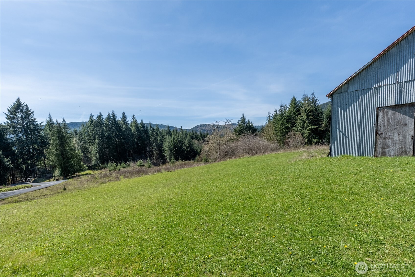 727 Greenwood Road Kalama, WA 98625 - Photo 2 of 17 a backyard of a house with lots of green space