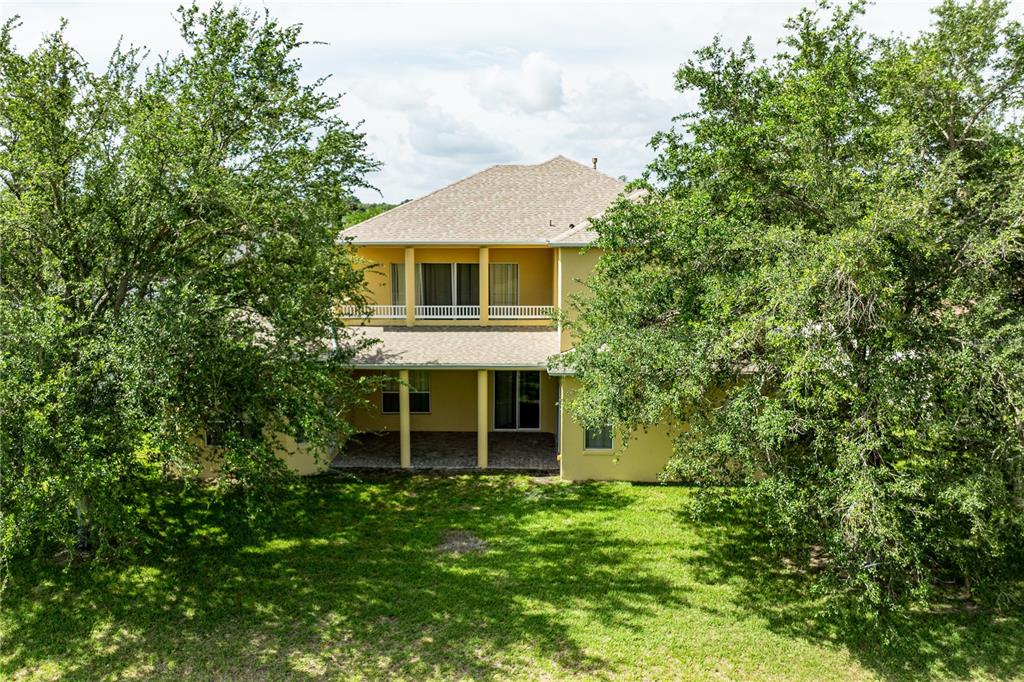 2718 Knightsbridge Road Clermont, FL 34711 - Photo 71 of 72 a view of a house with a yard