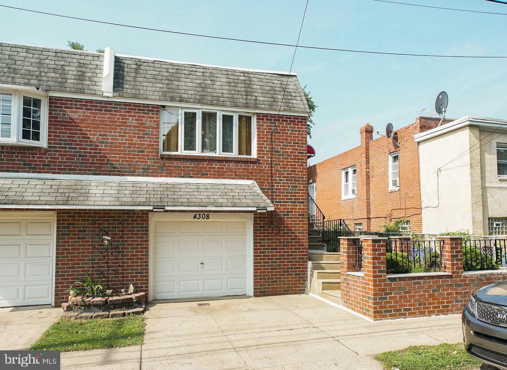 Front home; driveway and front garage