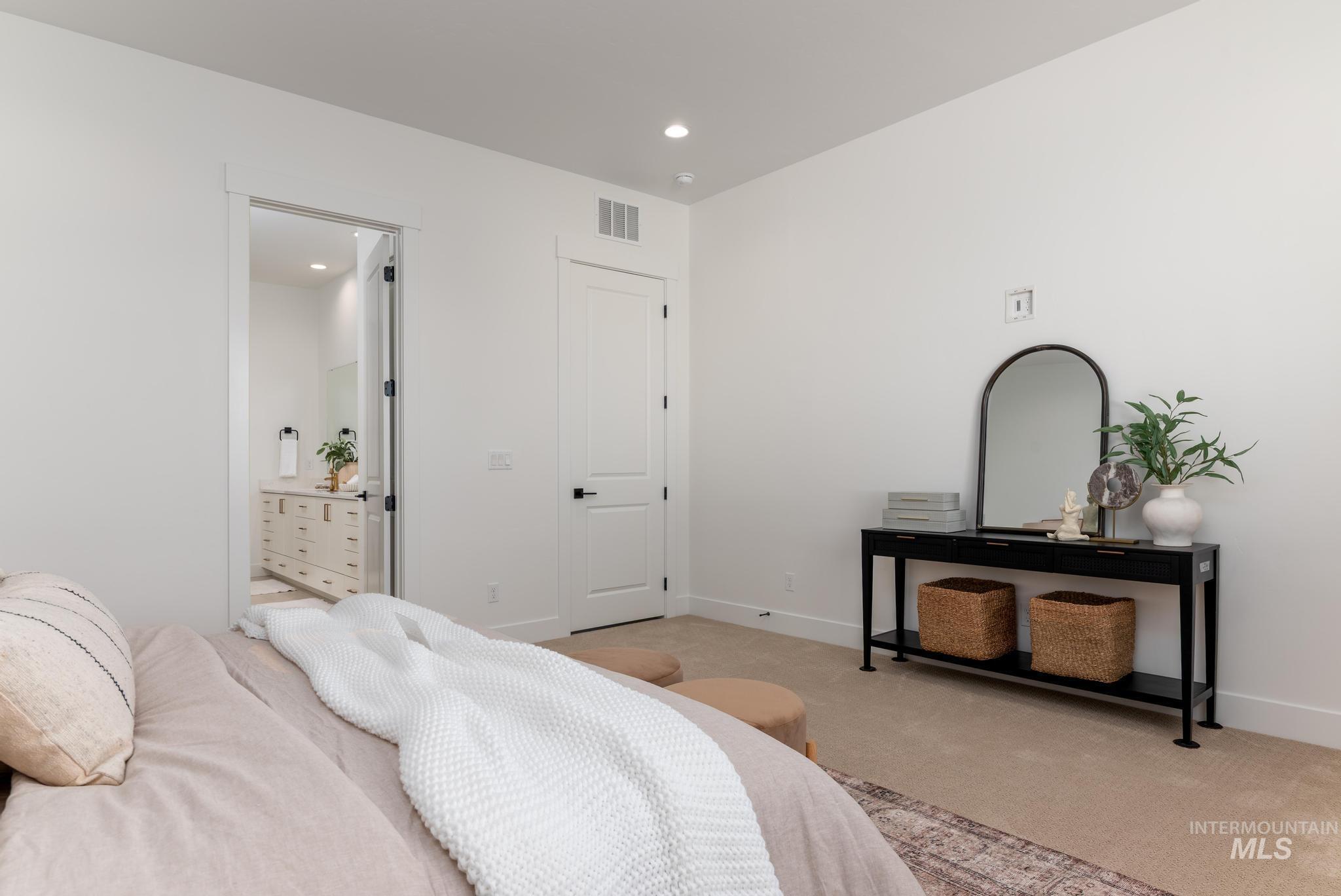 14703 Serenity Pt Street Caldwell, ID 83607 - Photo 19 of 45 Bright bedroom space featuring a neutral color palette, recessed lighting, and soft carpet flooring