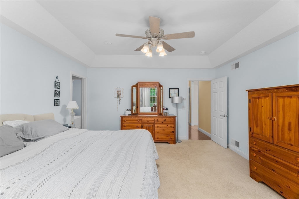 113 Greenwich Plains Road Ware, MA 01082 - Photo 17 of 42 a bedroom with a large bed and ceiling fan