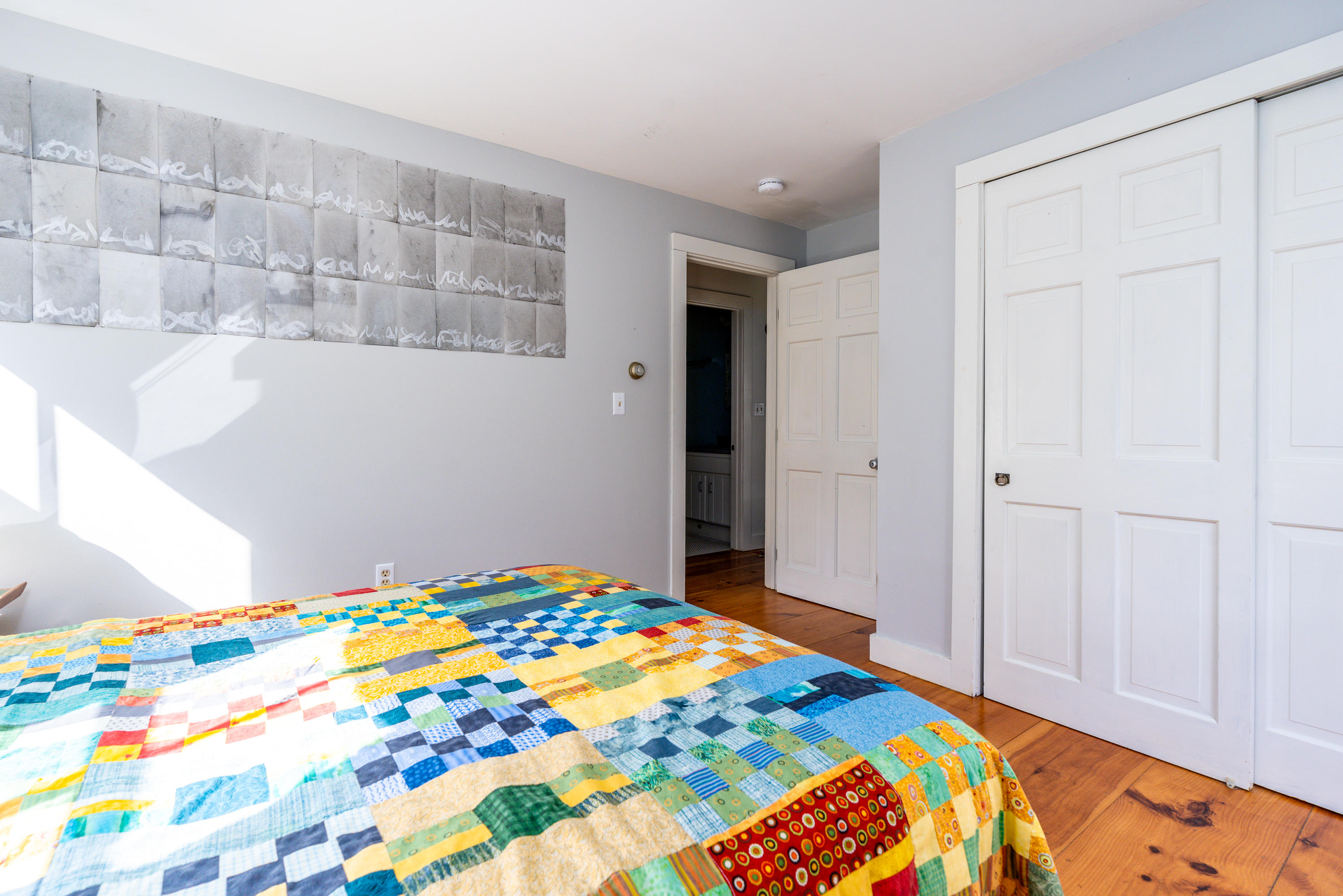 16 Meadow View Wellfleet, MA 02667 - Photo 18 of 36 a bedroom with bed and painting on the wall