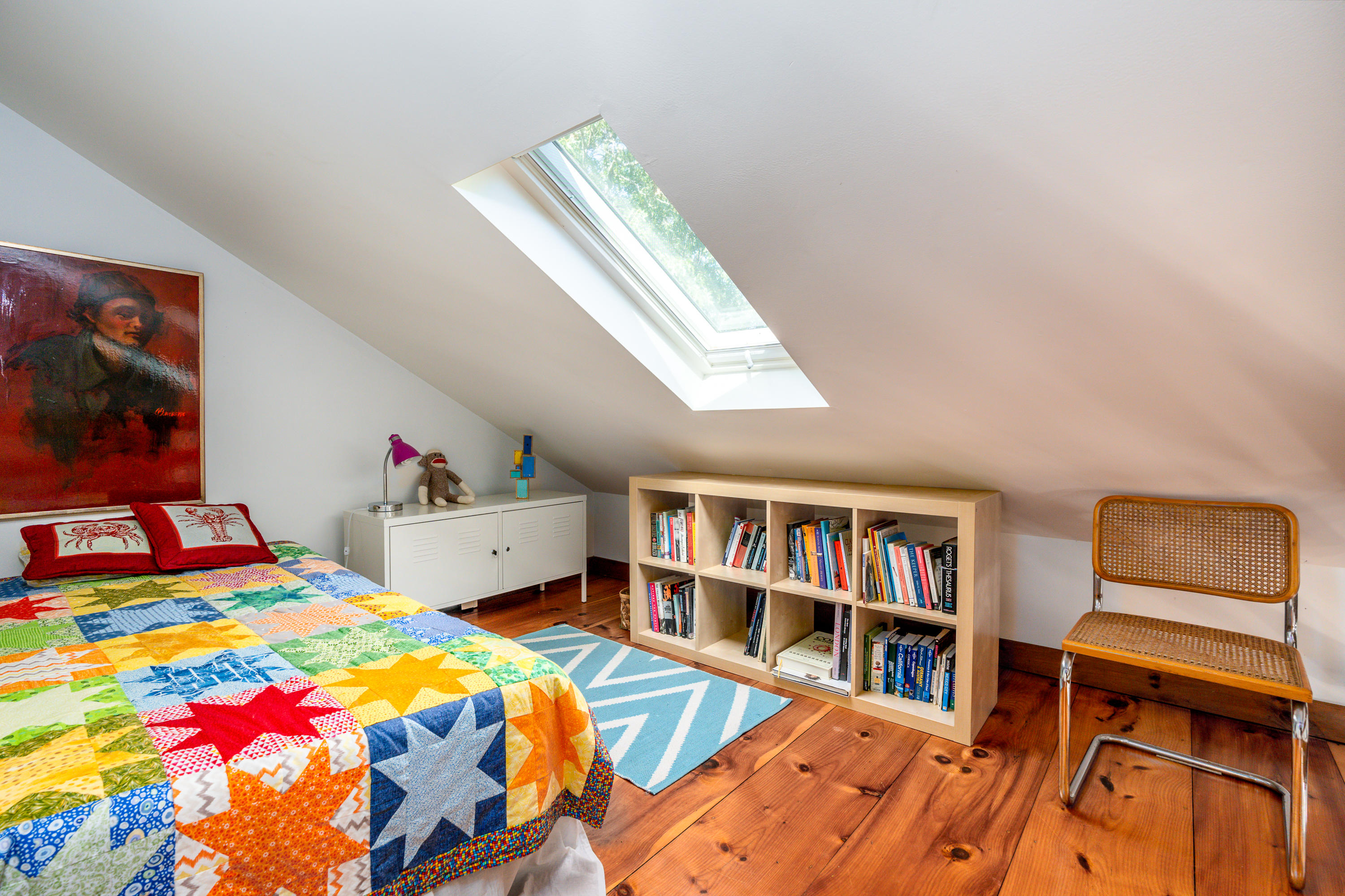 16 Meadow View Wellfleet, MA 02667 - Photo 21 of 36 a bedroom with a bed and a book shelf