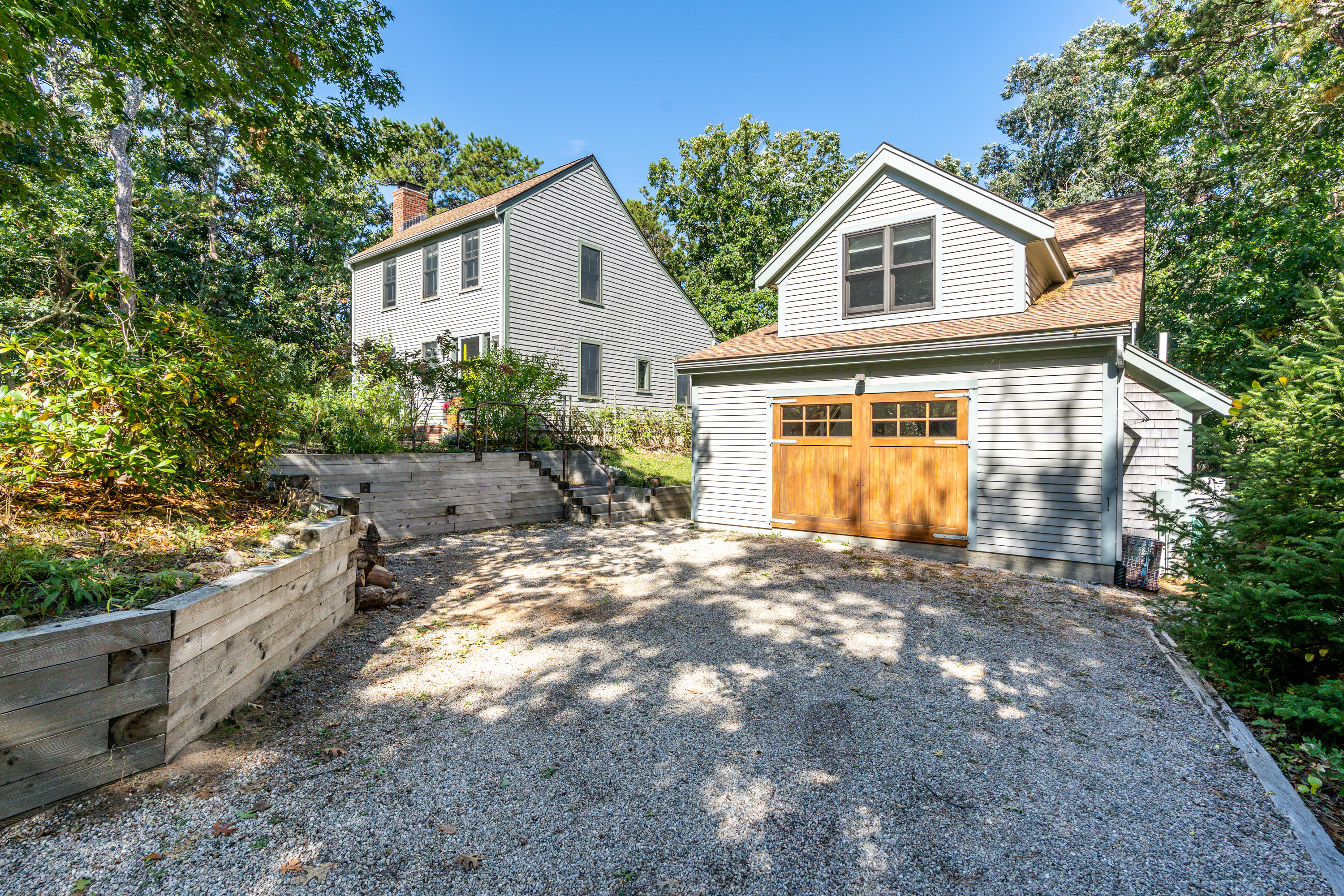 16 Meadow View Wellfleet, MA 02667 - Photo 36 of 36 a view of a house with a yard and potted plants