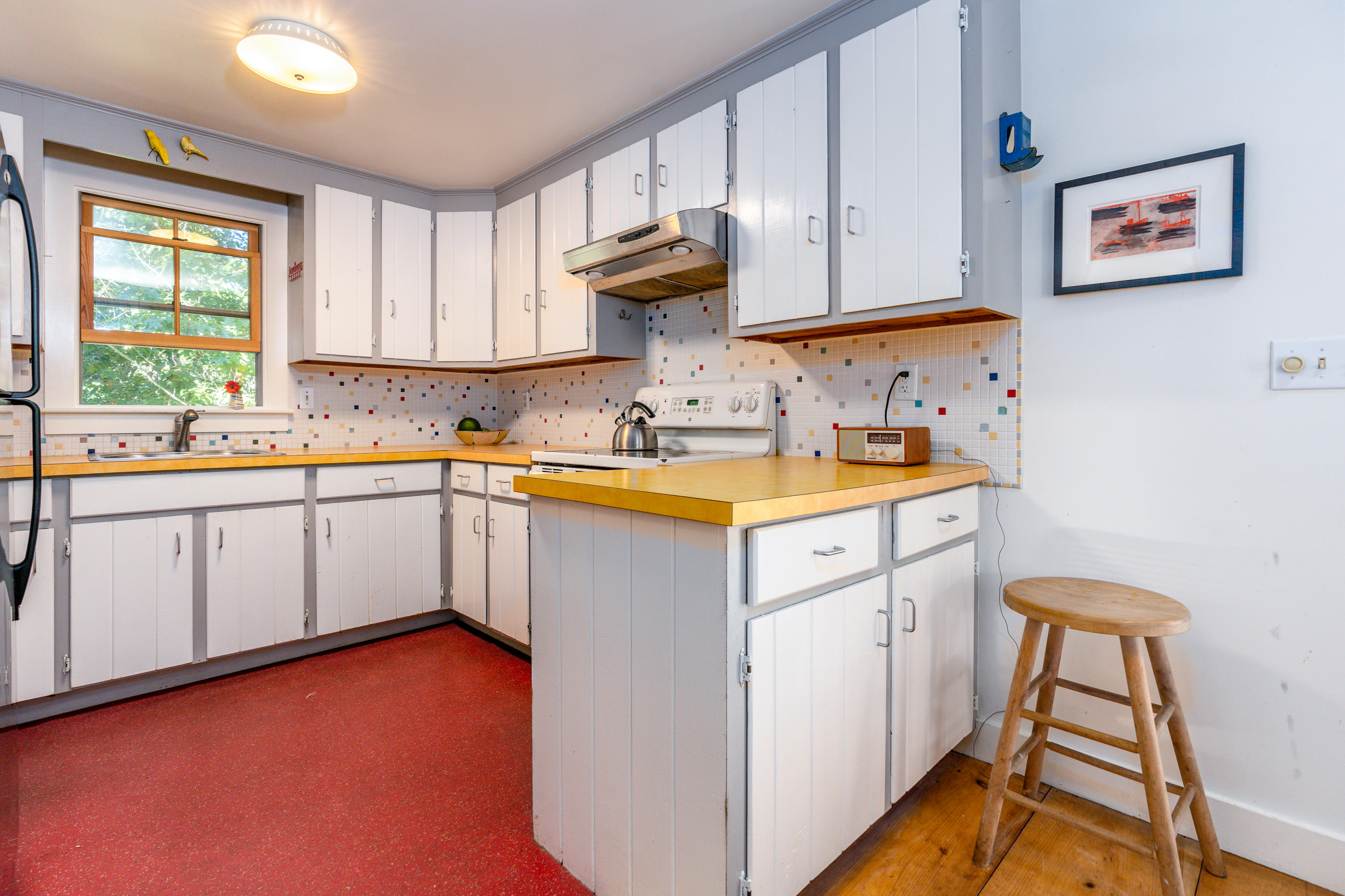 16 Meadow View Wellfleet, MA 02667 - Photo 9 of 36 a kitchen with a sink cabinets and window
