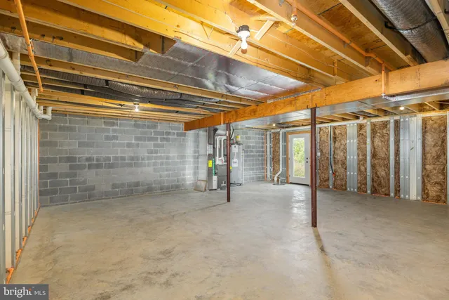 a view of a room with wooden walls