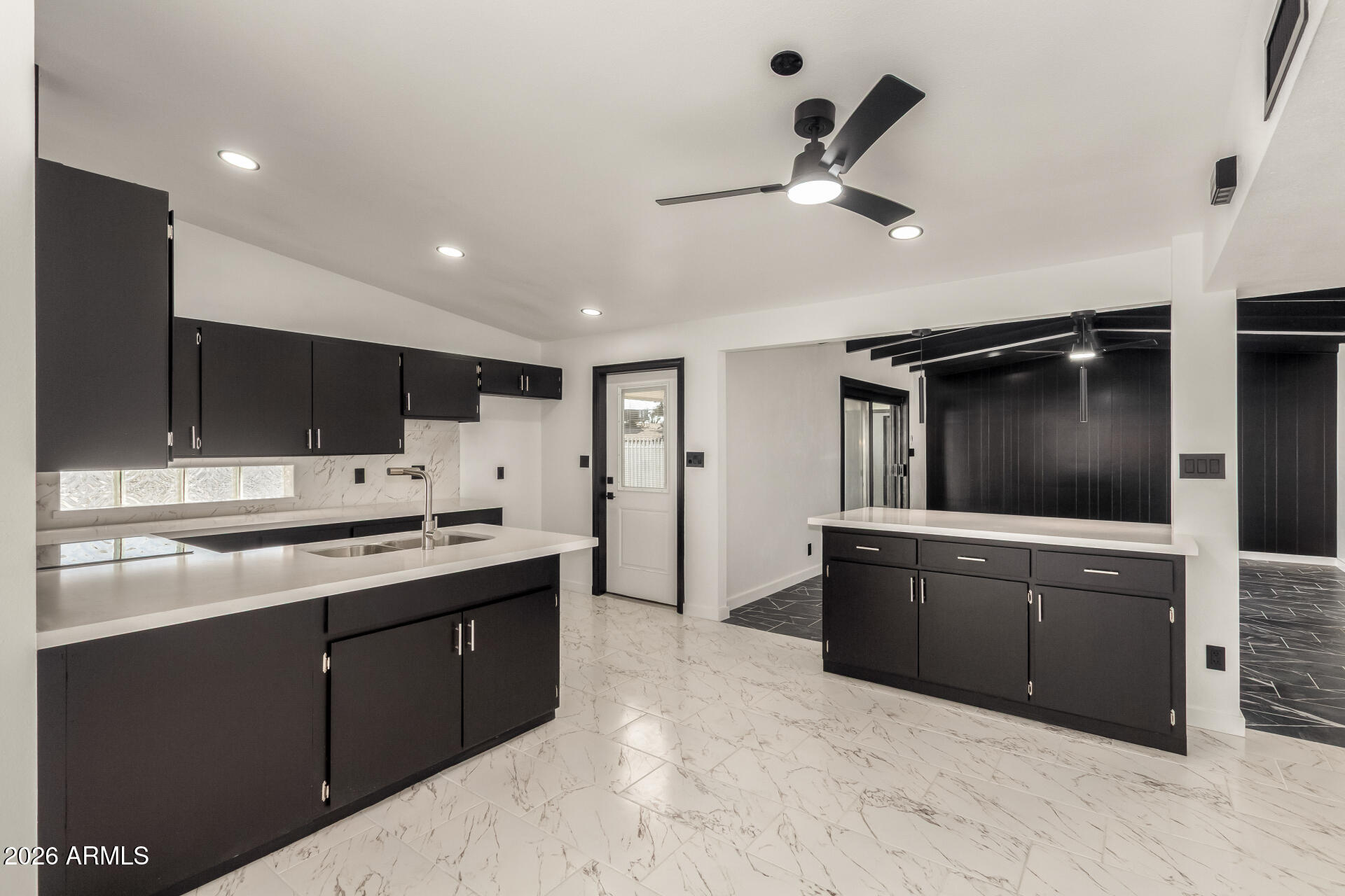 3001 West Ocotillo Road Phoenix, AZ 85017 - Photo 13 of 42 a kitchen with stainless steel appliances kitchen island granite countertop a sink and cabinets