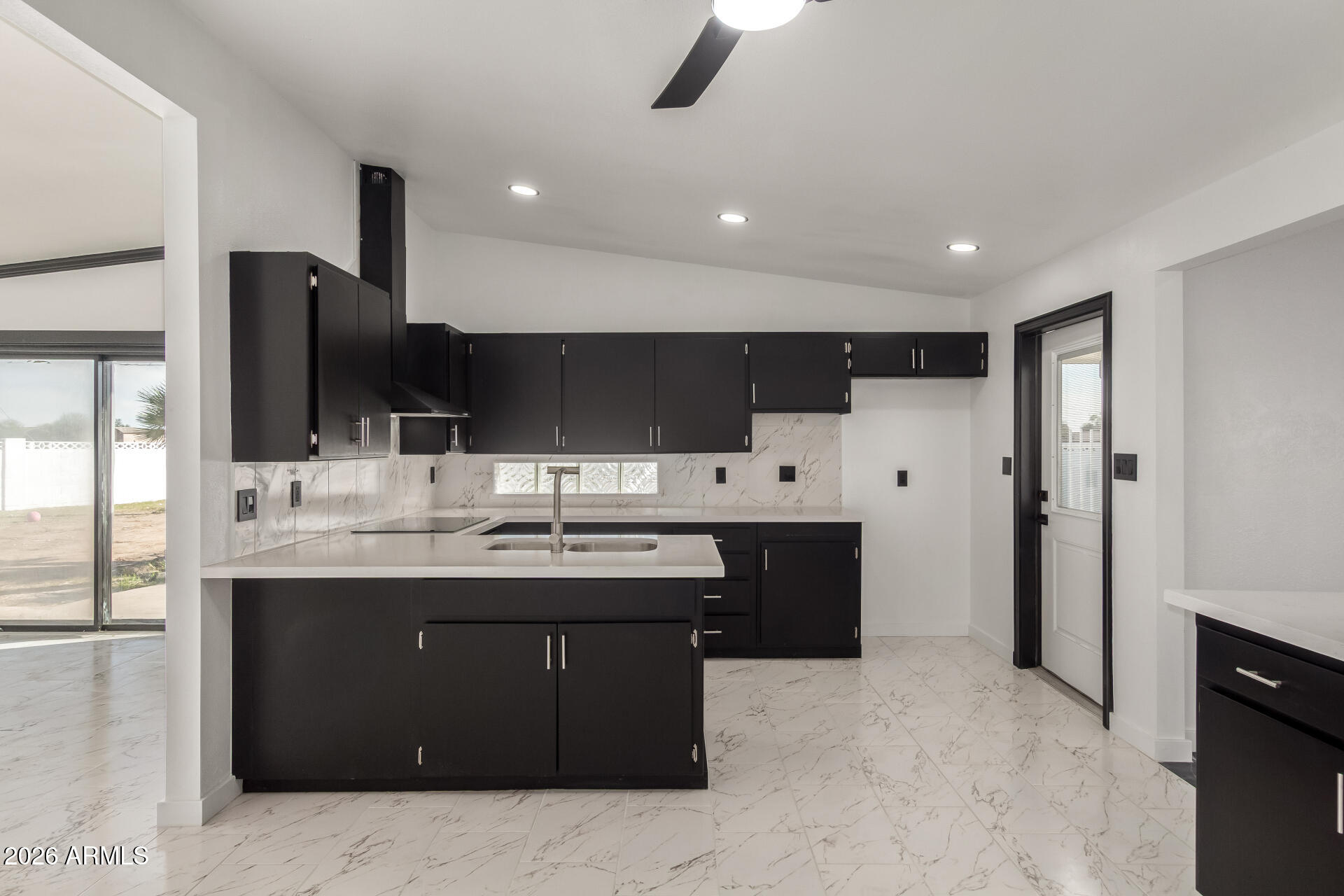 3001 West Ocotillo Road Phoenix, AZ 85017 - Photo 14 of 42 a kitchen with stainless steel appliances granite countertop a sink and a refrigerator