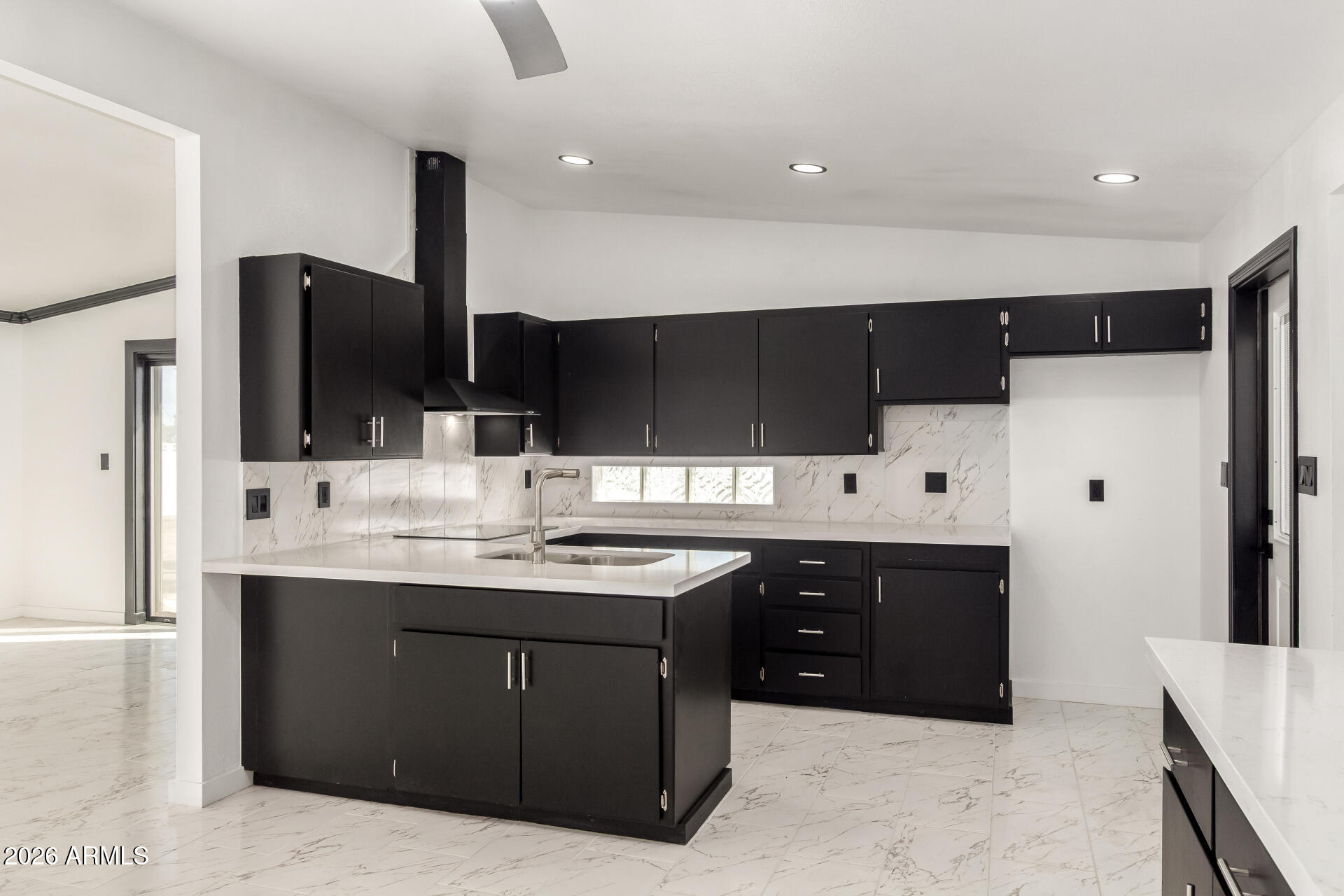3001 West Ocotillo Road Phoenix, AZ 85017 - Photo 15 of 42 a kitchen with stainless steel appliances kitchen island granite countertop a sink and a refrigerator