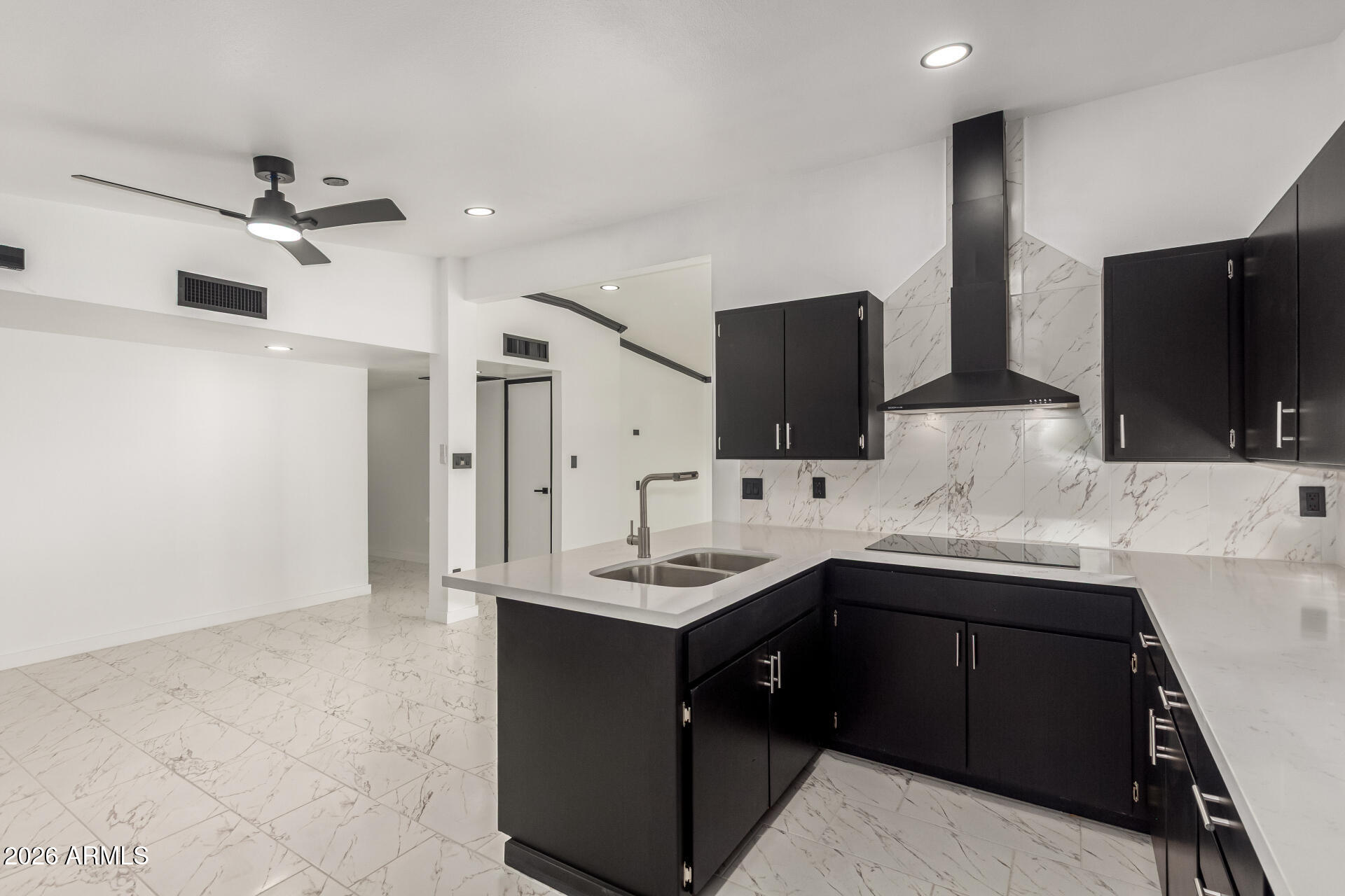 3001 West Ocotillo Road Phoenix, AZ 85017 - Photo 17 of 42 a kitchen with a sink and a refrigerator