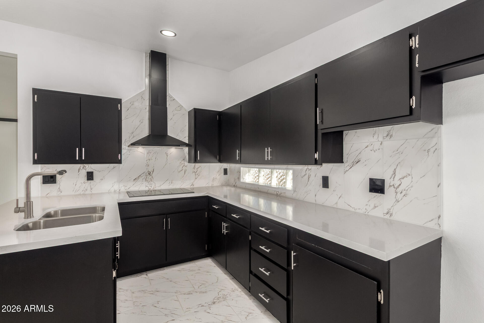 3001 West Ocotillo Road Phoenix, AZ 85017 - Photo 18 of 42 a kitchen with a sink and a refrigerator