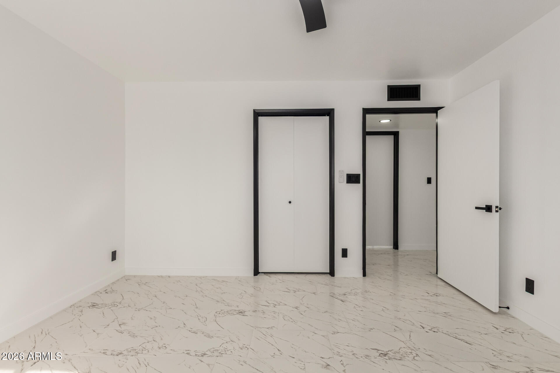 3001 West Ocotillo Road Phoenix, AZ 85017 - Photo 20 of 42 an empty room with closet and windows