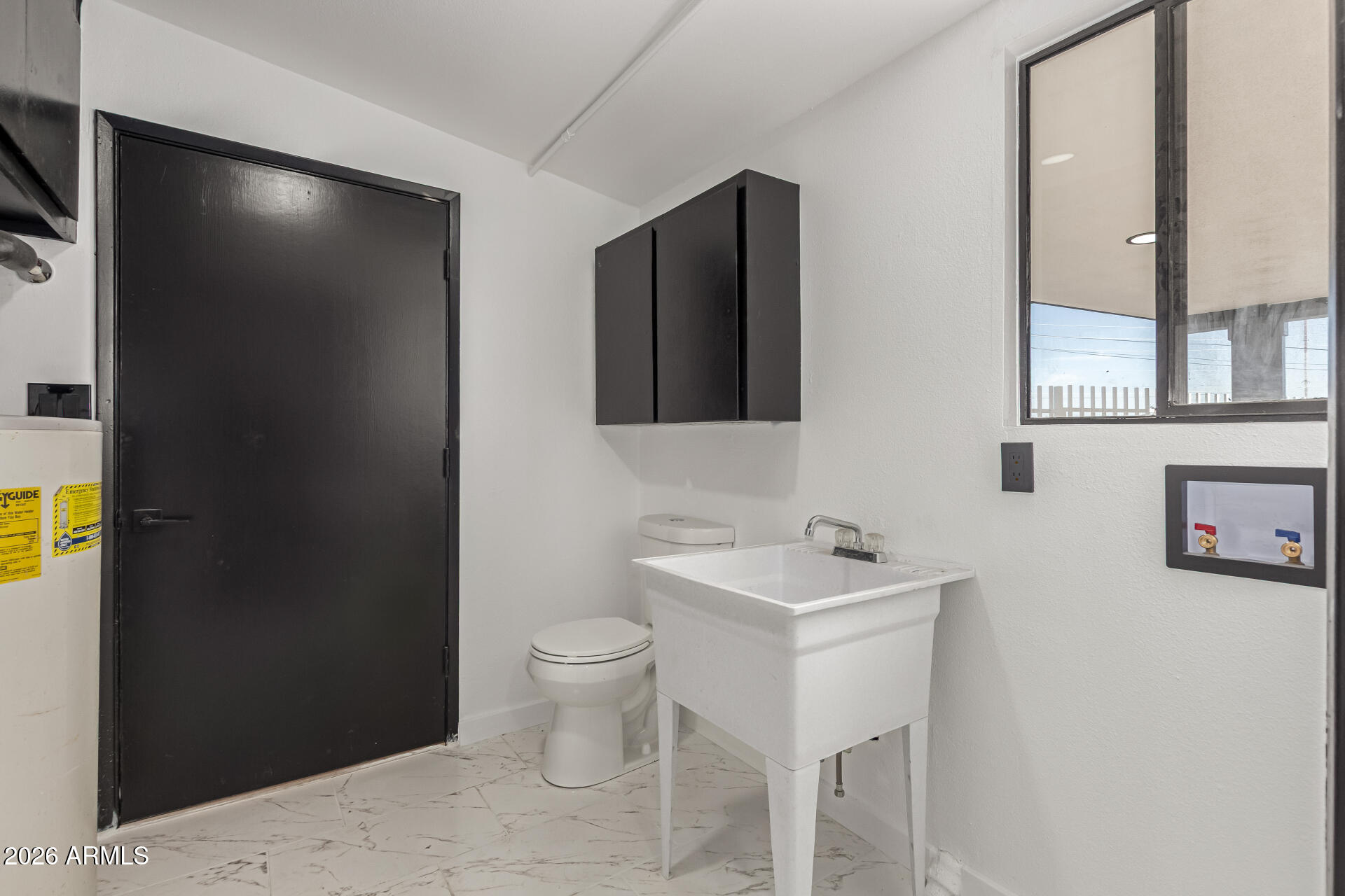 3001 West Ocotillo Road Phoenix, AZ 85017 - Photo 32 of 42 a bathroom with a sink and a mirror