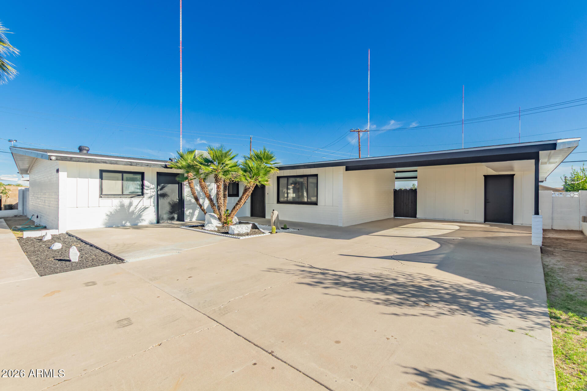 3001 West Ocotillo Road Phoenix, AZ 85017 - Photo 4 of 42 a front view of a house with a yard and garage