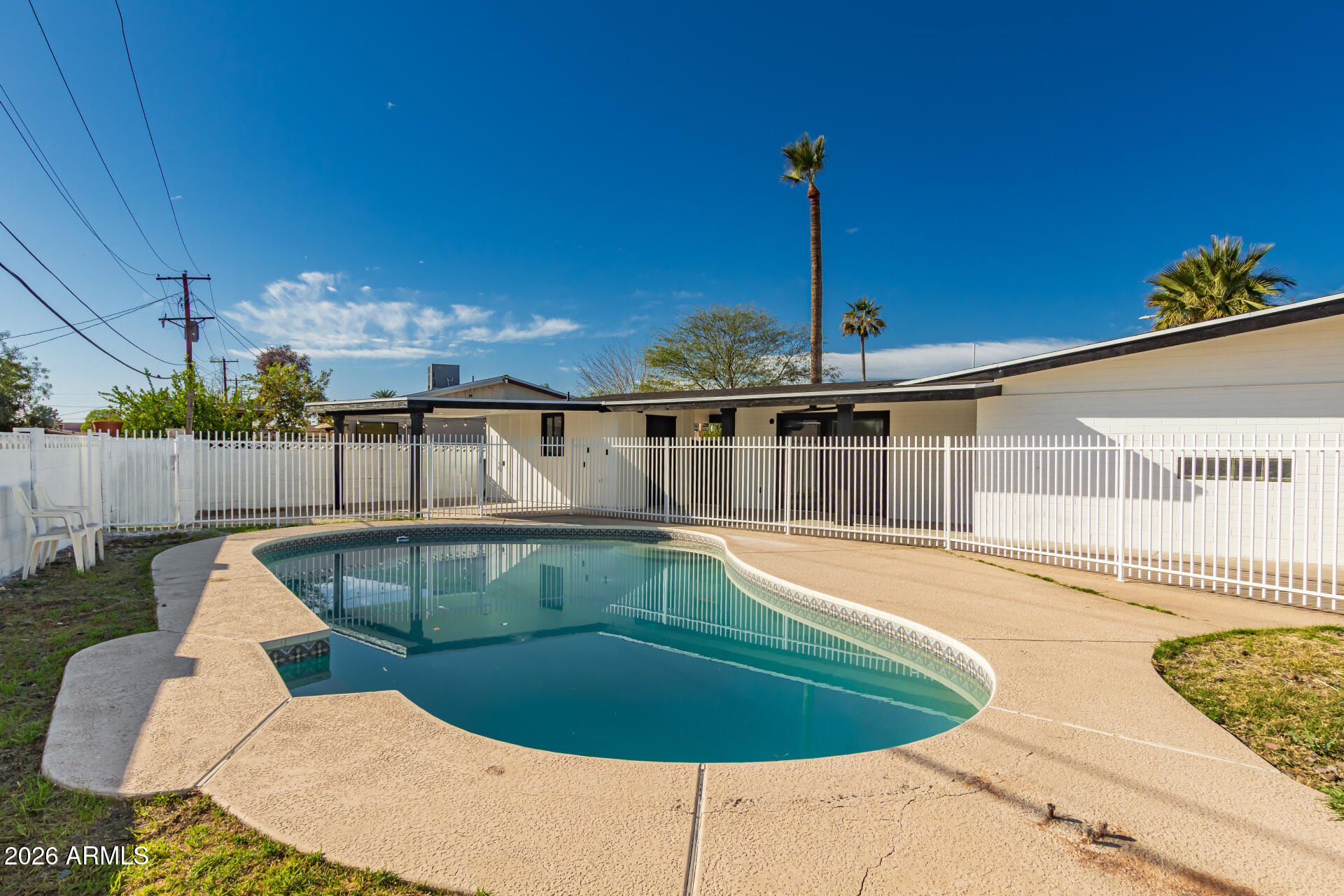 3001 West Ocotillo Road Phoenix, AZ 85017 - Photo 41 of 42 a view of a swimming pool with a chairs